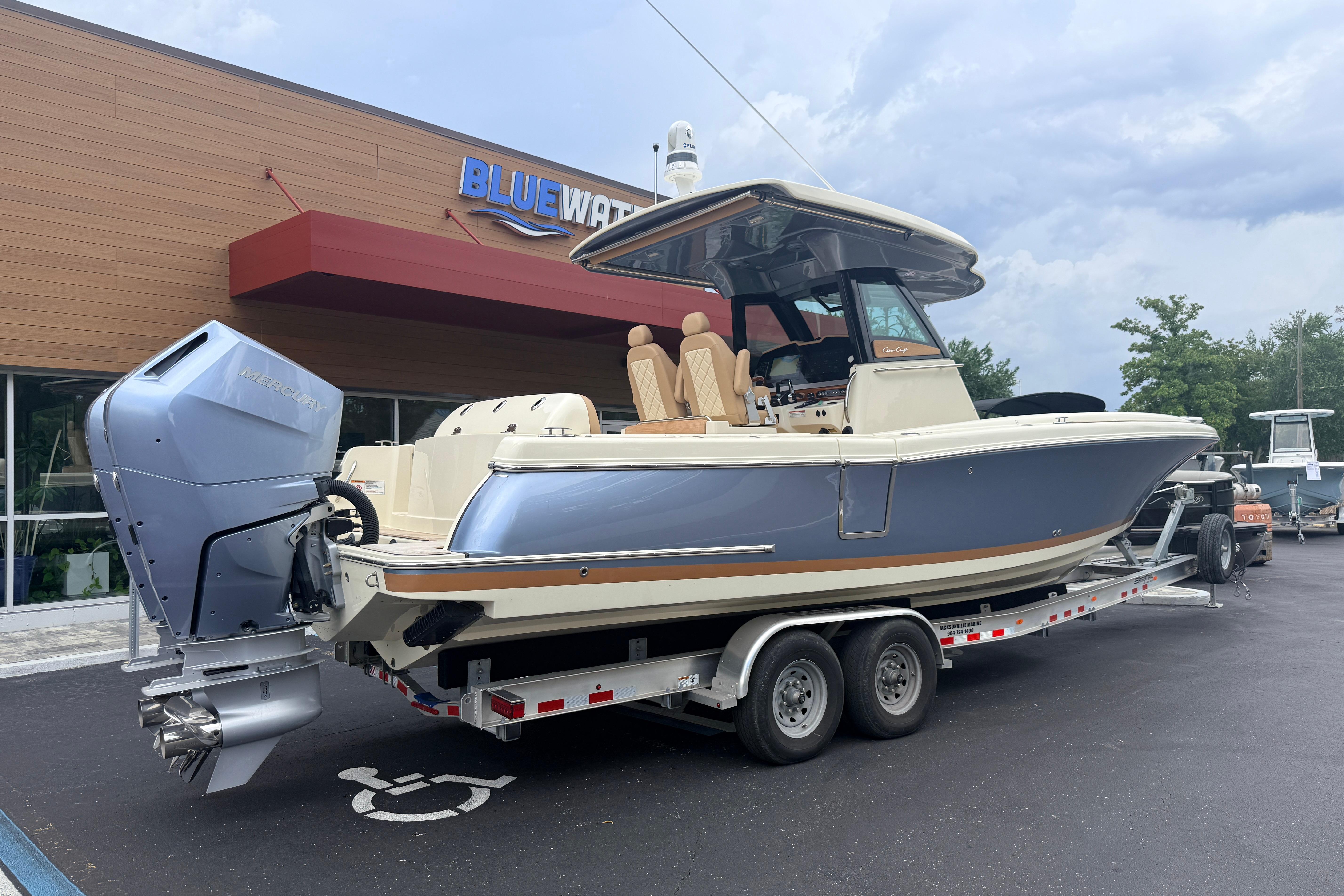 2024 Chris-Craft Catalina 30 boat on trailer, parked outside Bluewater building.