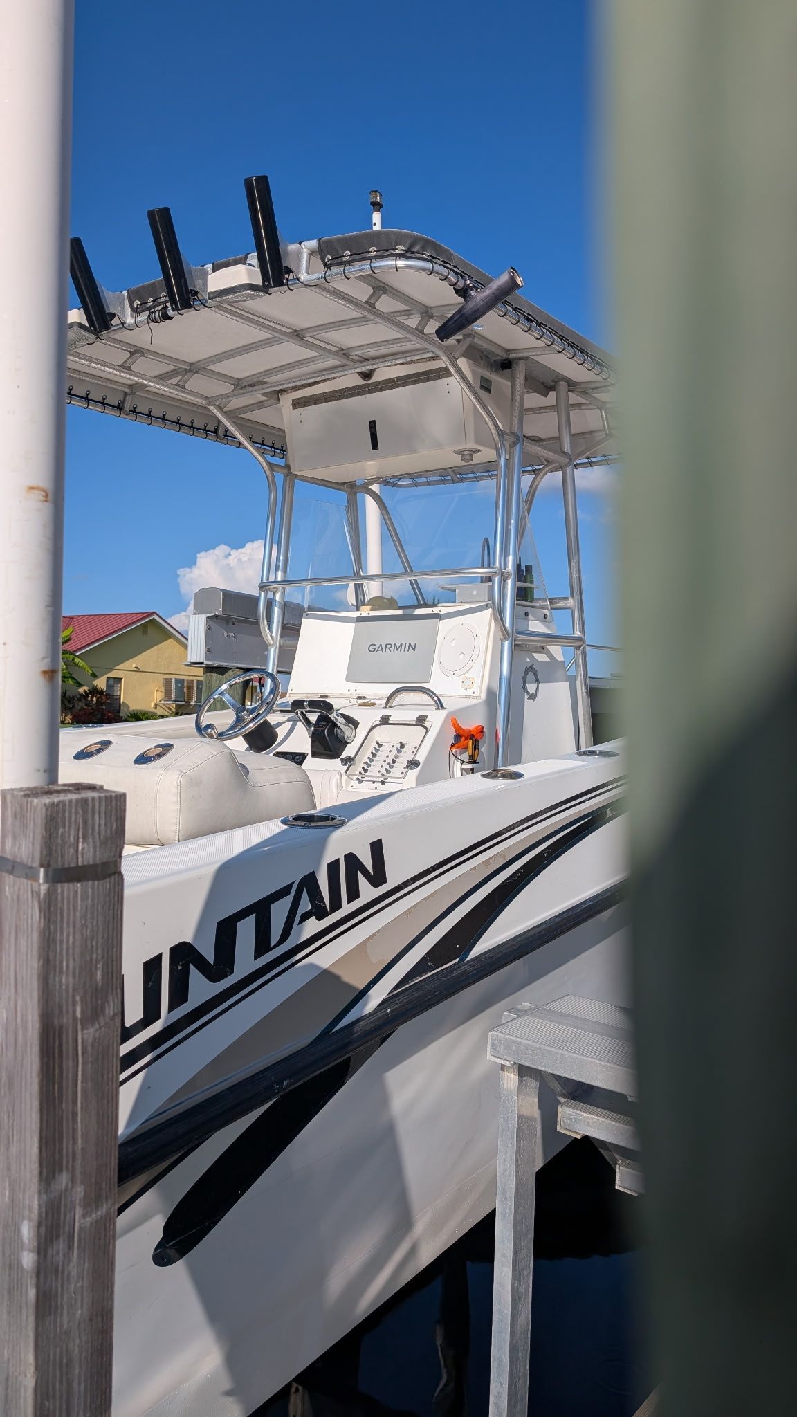 1997 Fountain Center Console boat docked.