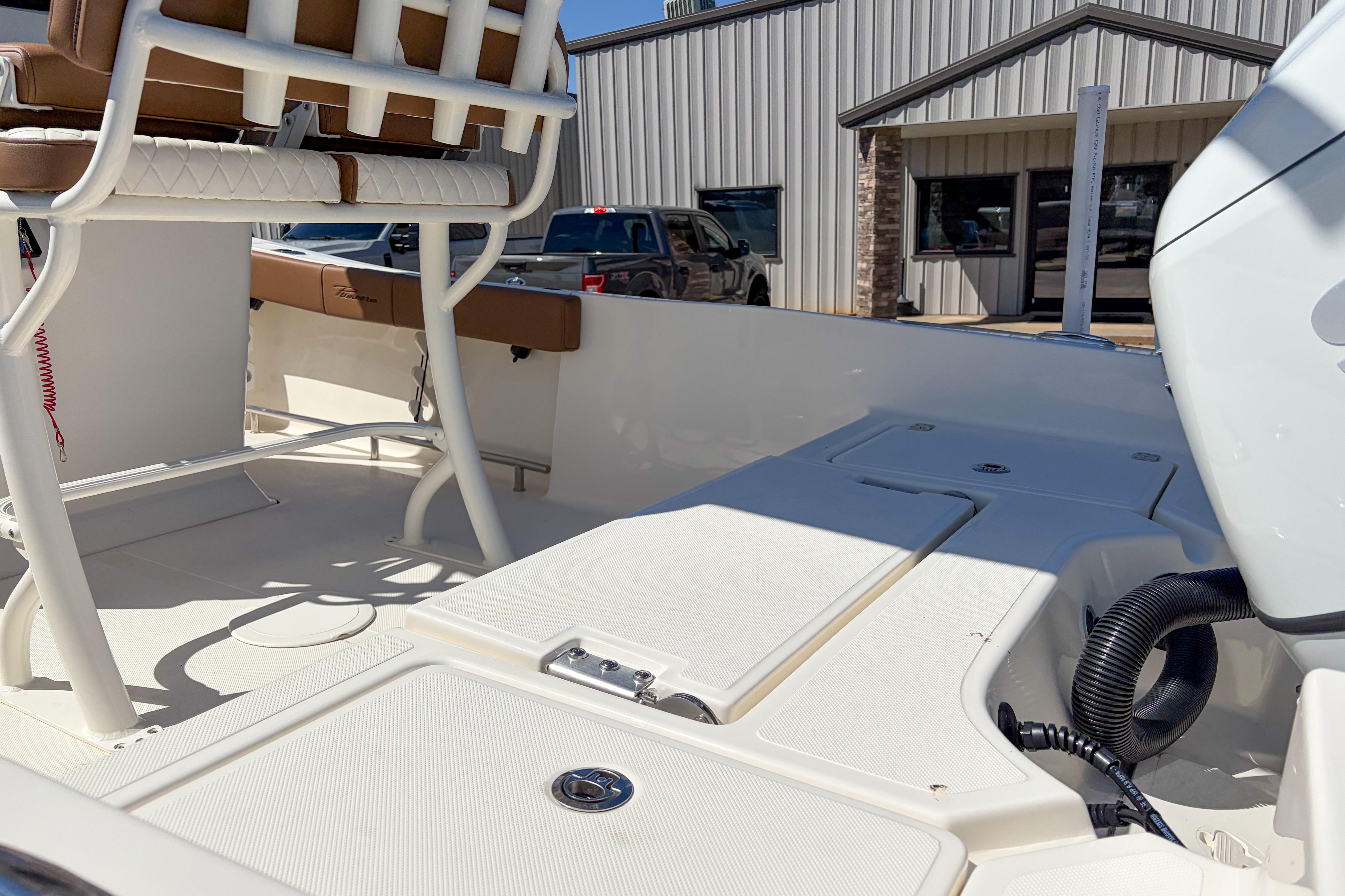 2026 Pioneer 220 Bay Sport boat interior with seating and storage compartments.