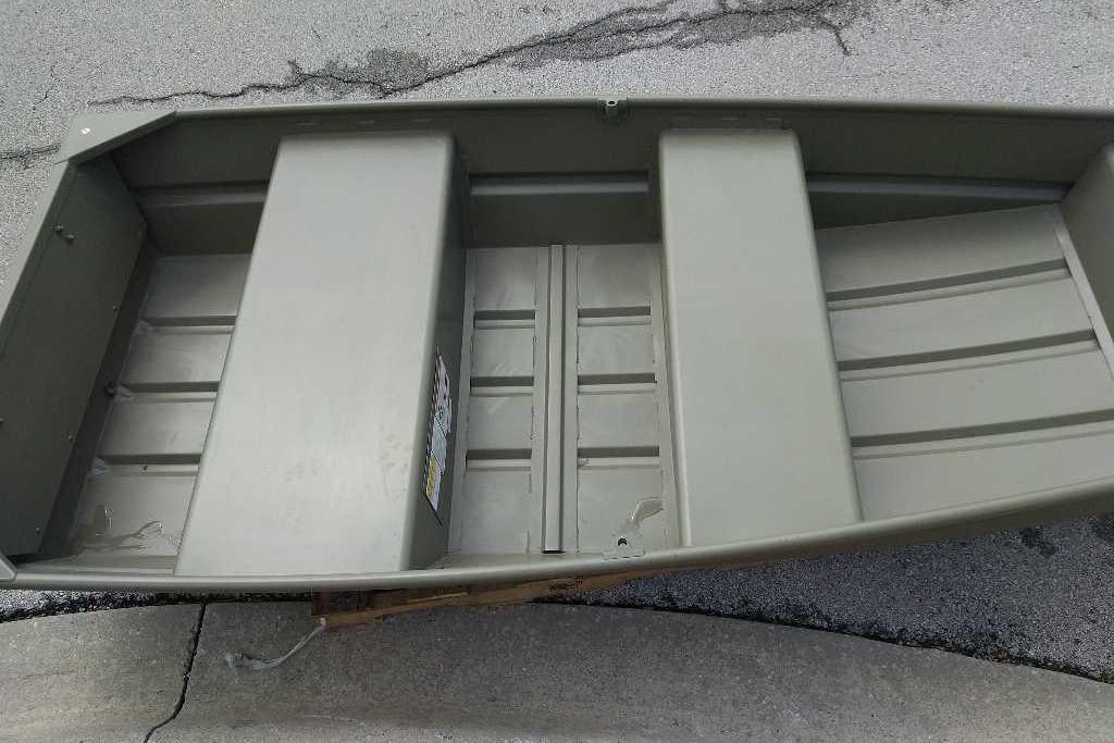 2026 Tracker Grizzly 10 Jon boat, interior view on pavement.