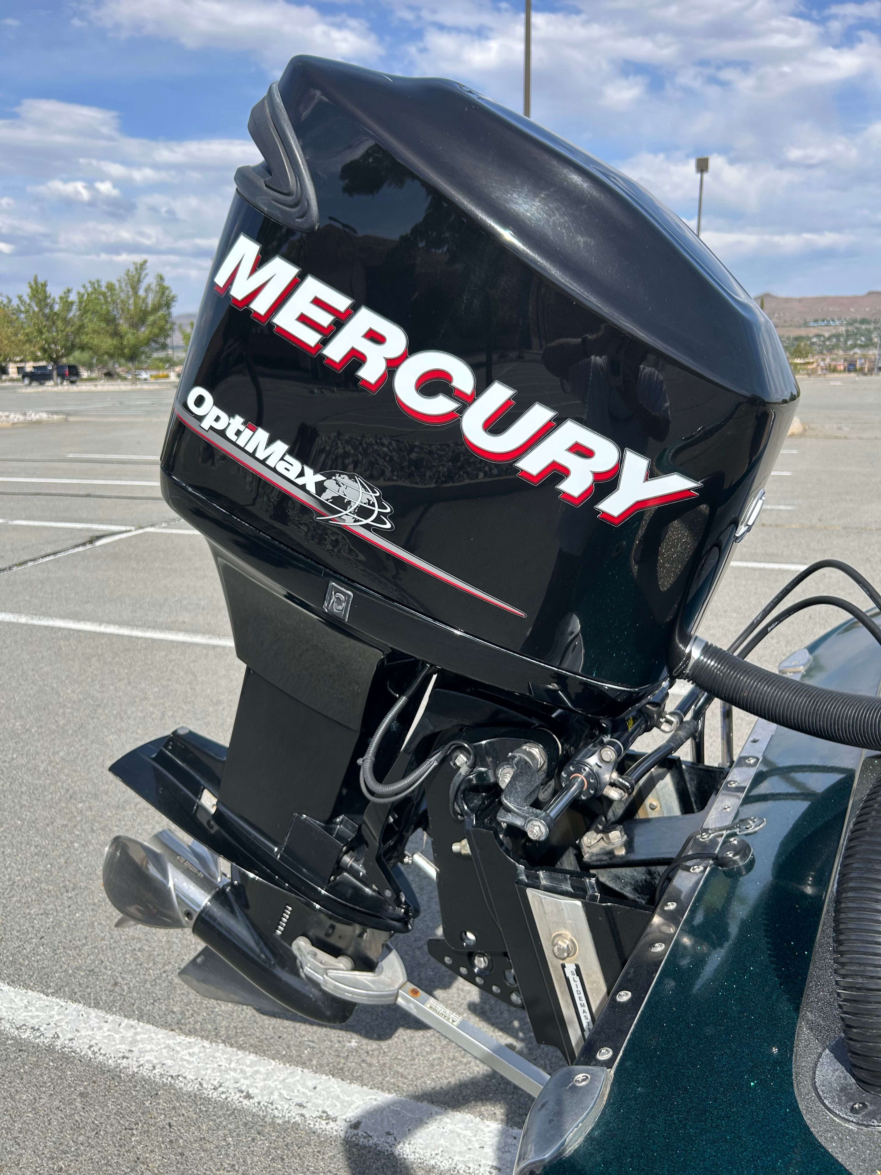 Mercury OptiMax outboard motor on a 2008 Champion 183 boat.