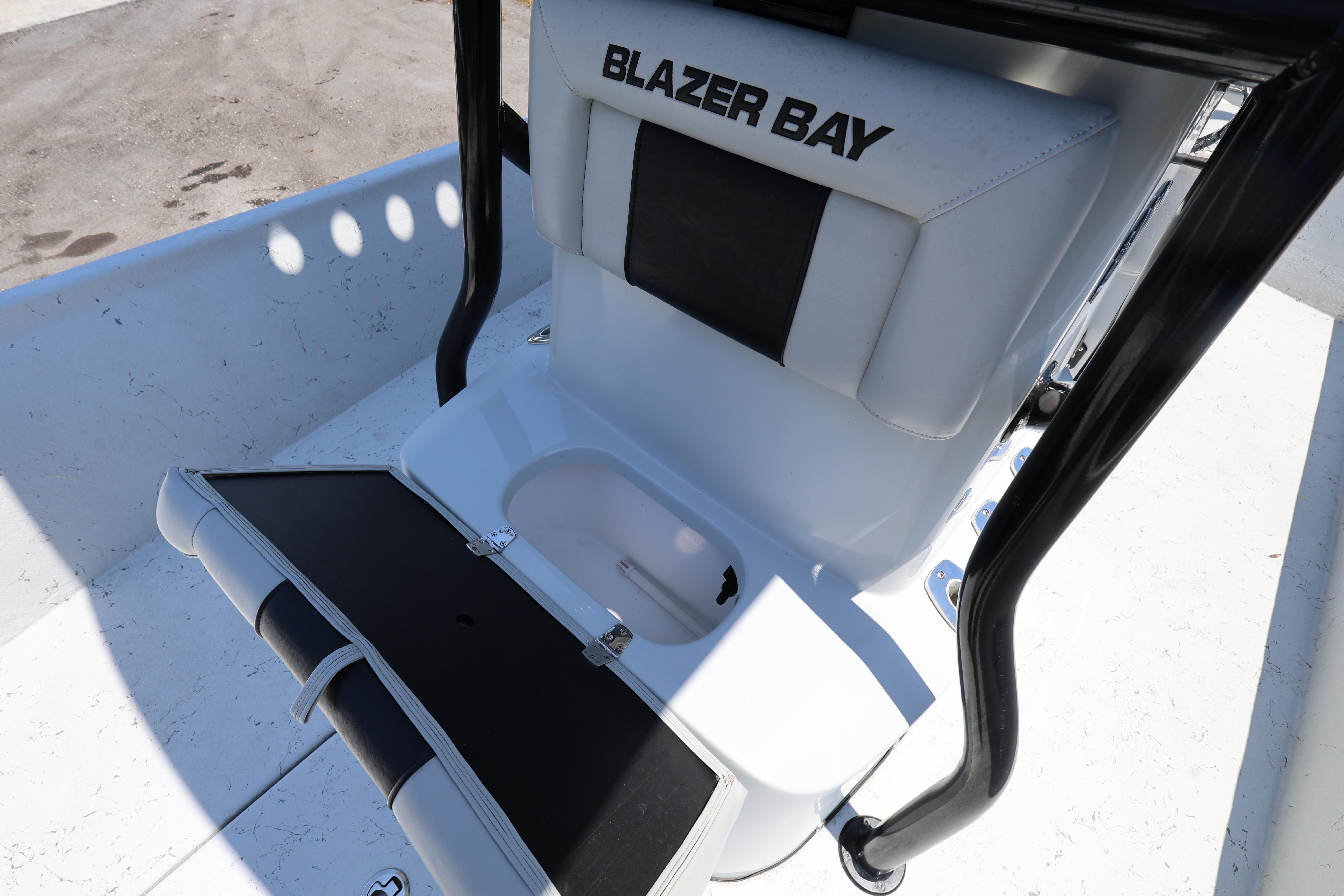 2021 Blazer Bay 2400 boat seat with storage compartment, open on deck.