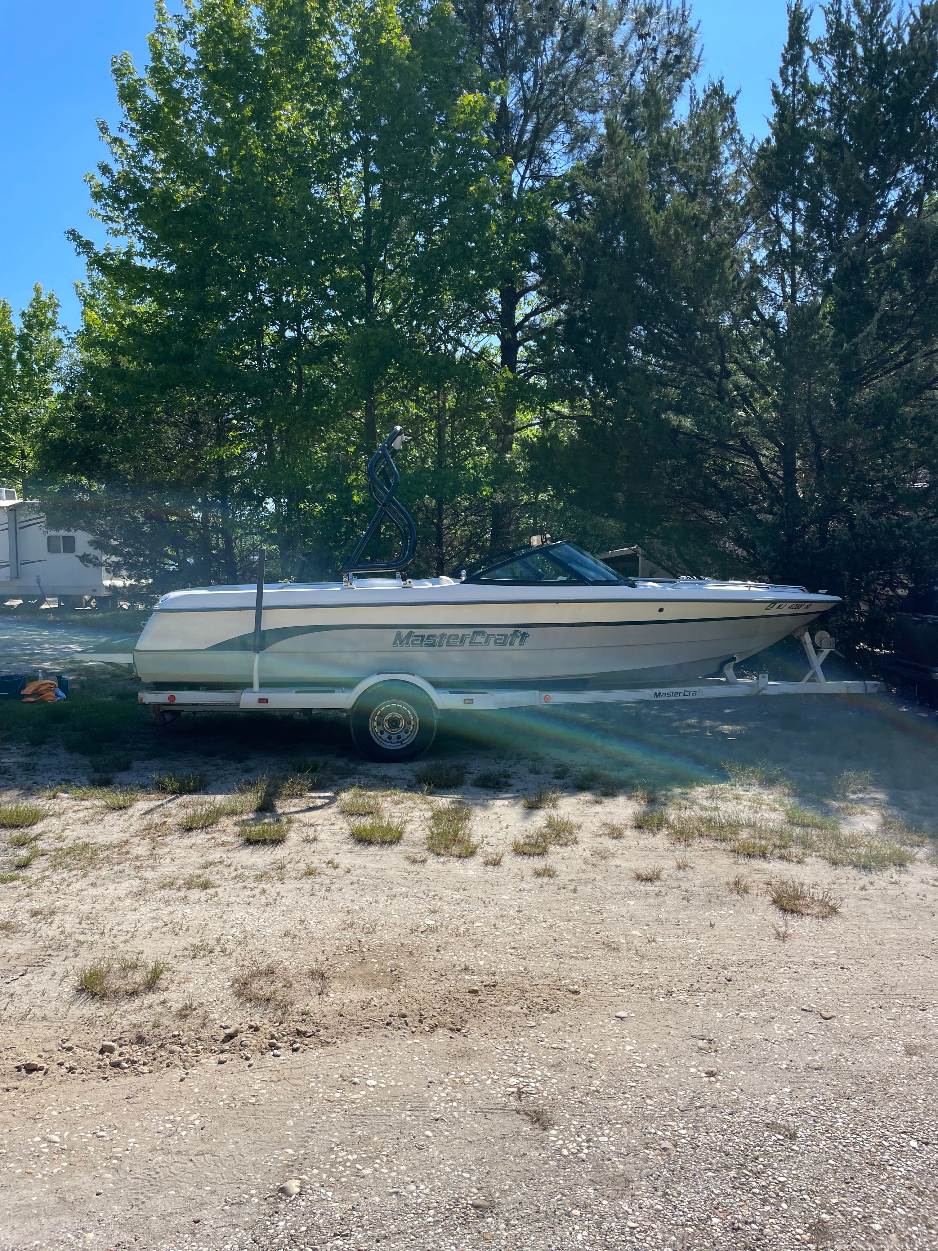 1997 MasterCraft Prostar 205 on a trailer outdoors.