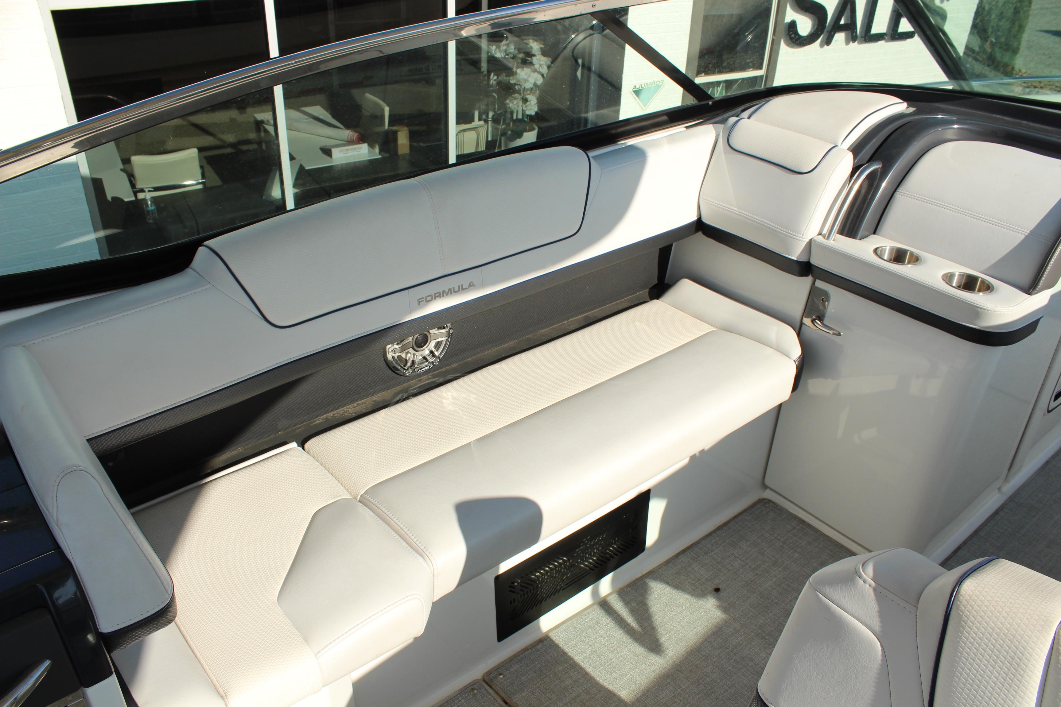 2023 Formula 310 Bowrider I/O interior with white seating and cup holders.