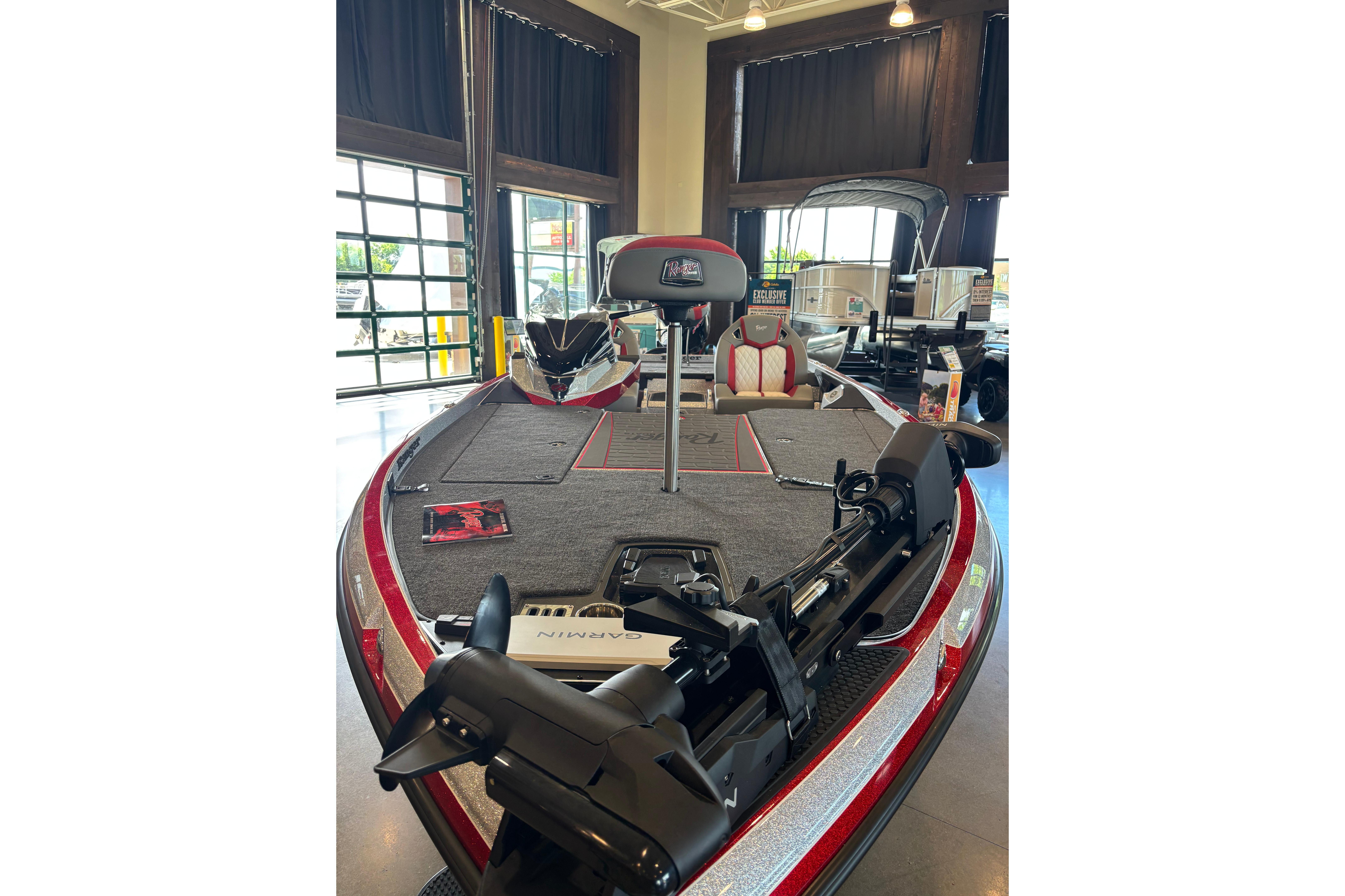 2026 Ranger Z520R Cup-Equipped boat displayed indoors, featuring advanced fishing equipment.