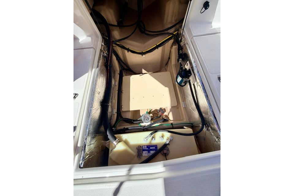 2017 Cutwater C-242 Coupe engine compartment with visible wiring and components.