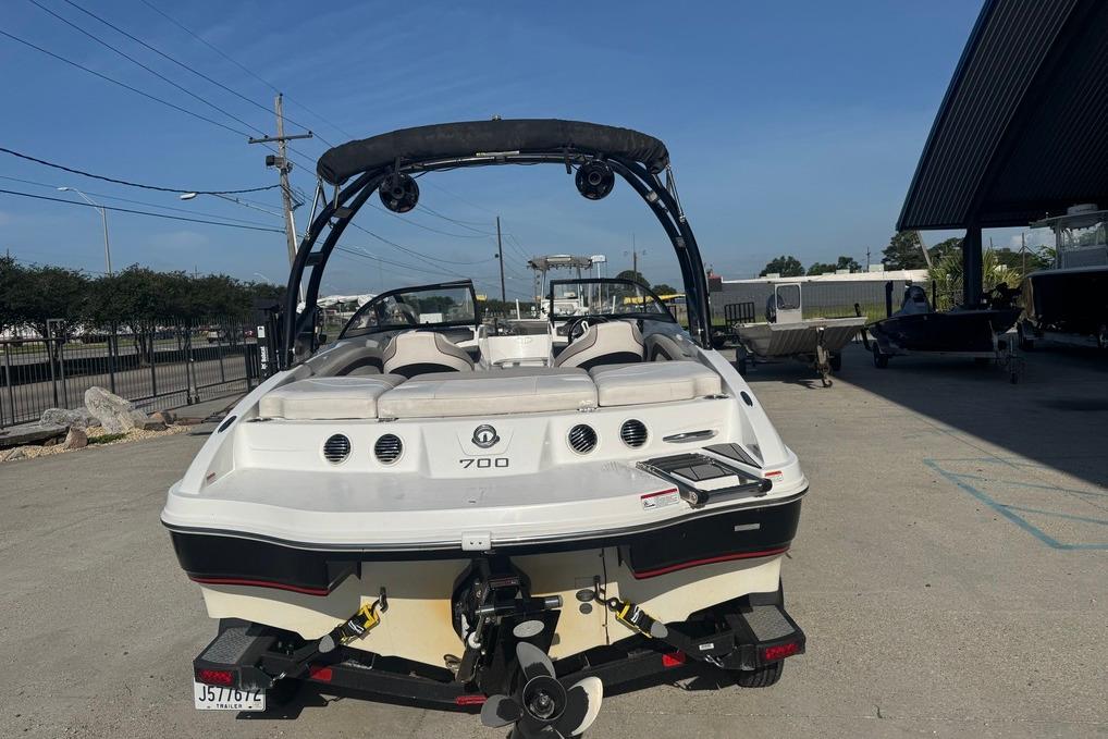 2018 Tahoe 700 TF boat parked outdoors on a sunny day.