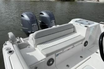 2023 Sea Fox 268 Commander boat with dual engines on a calm waterway.
