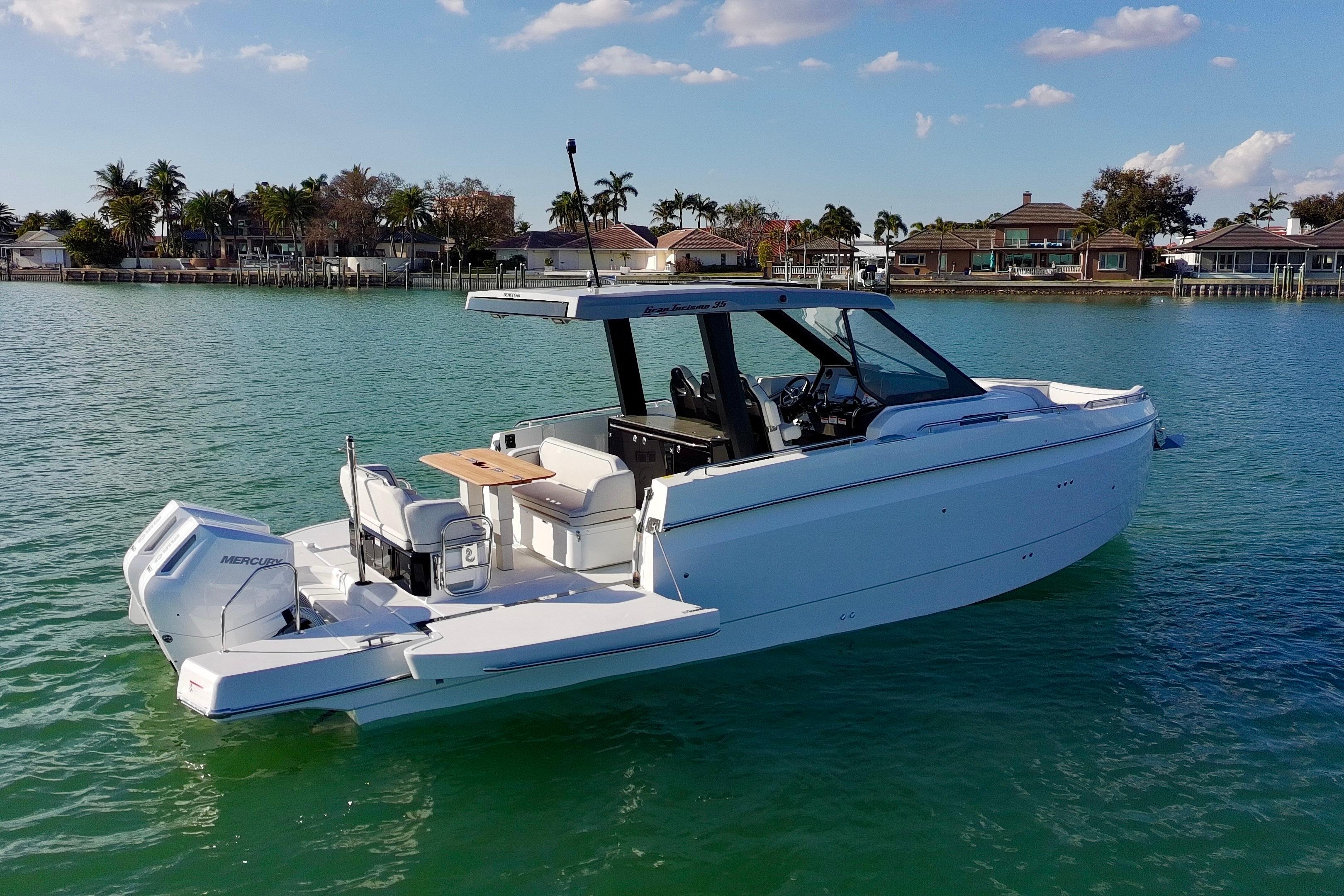 2026 Beneteau Gran Turismo 35 yacht on serene water, showcasing sleek design and luxury features.