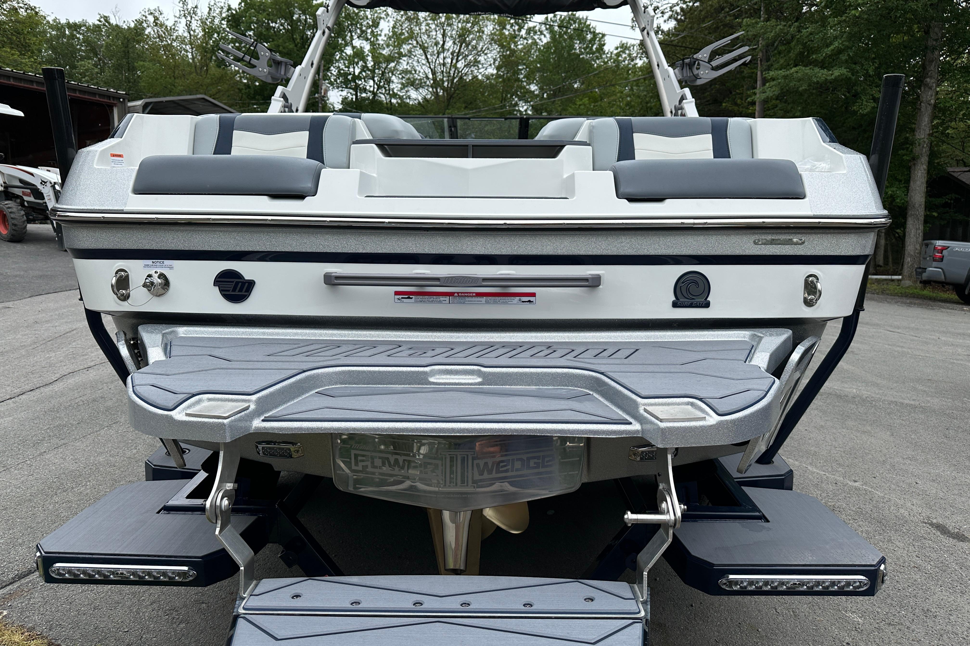 2025 Malibu Wakesetter 22 MXZ rear view with swim platform and seating.
