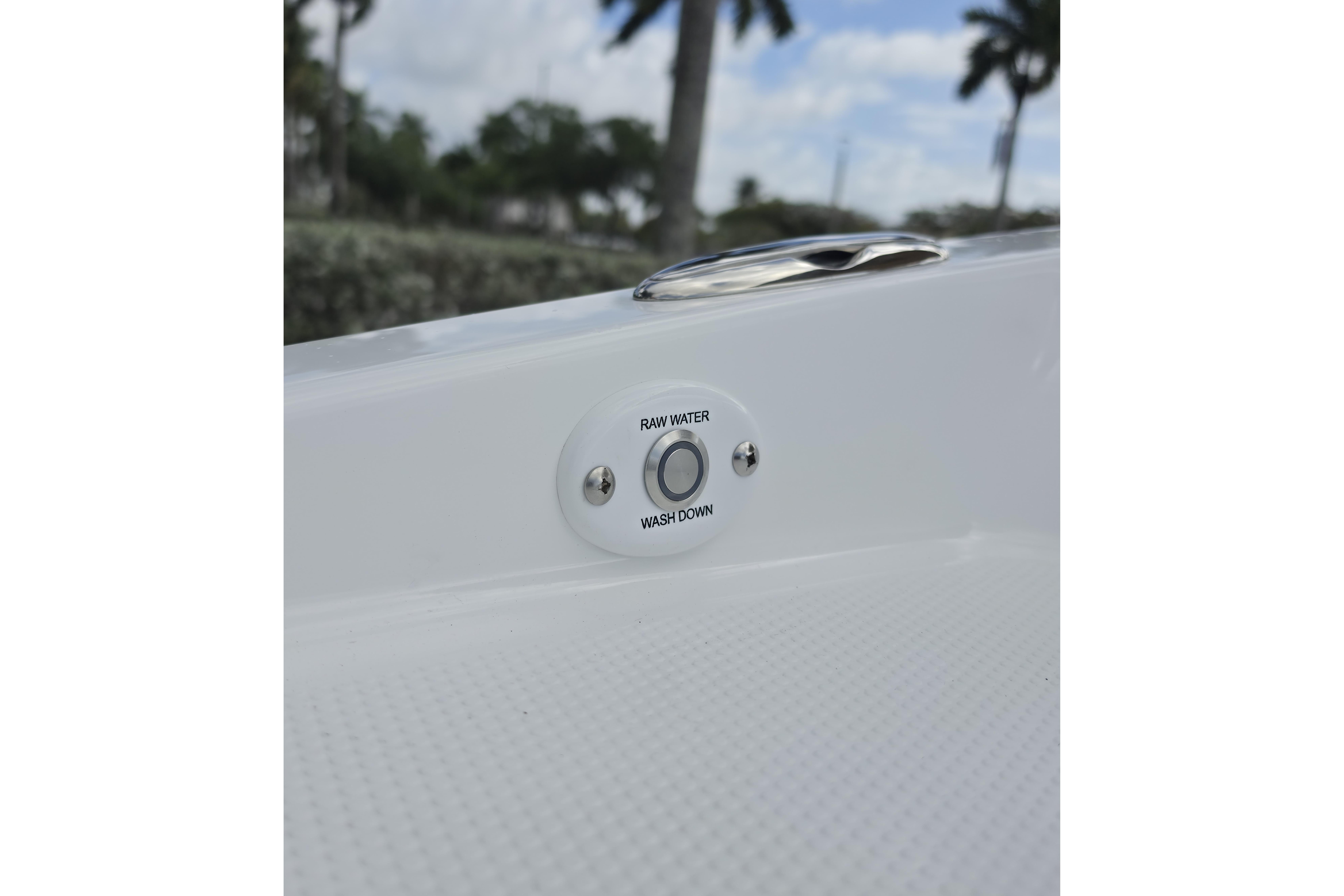 2026 Tahoe 2150 CC boat raw water washdown feature with outdoor background.