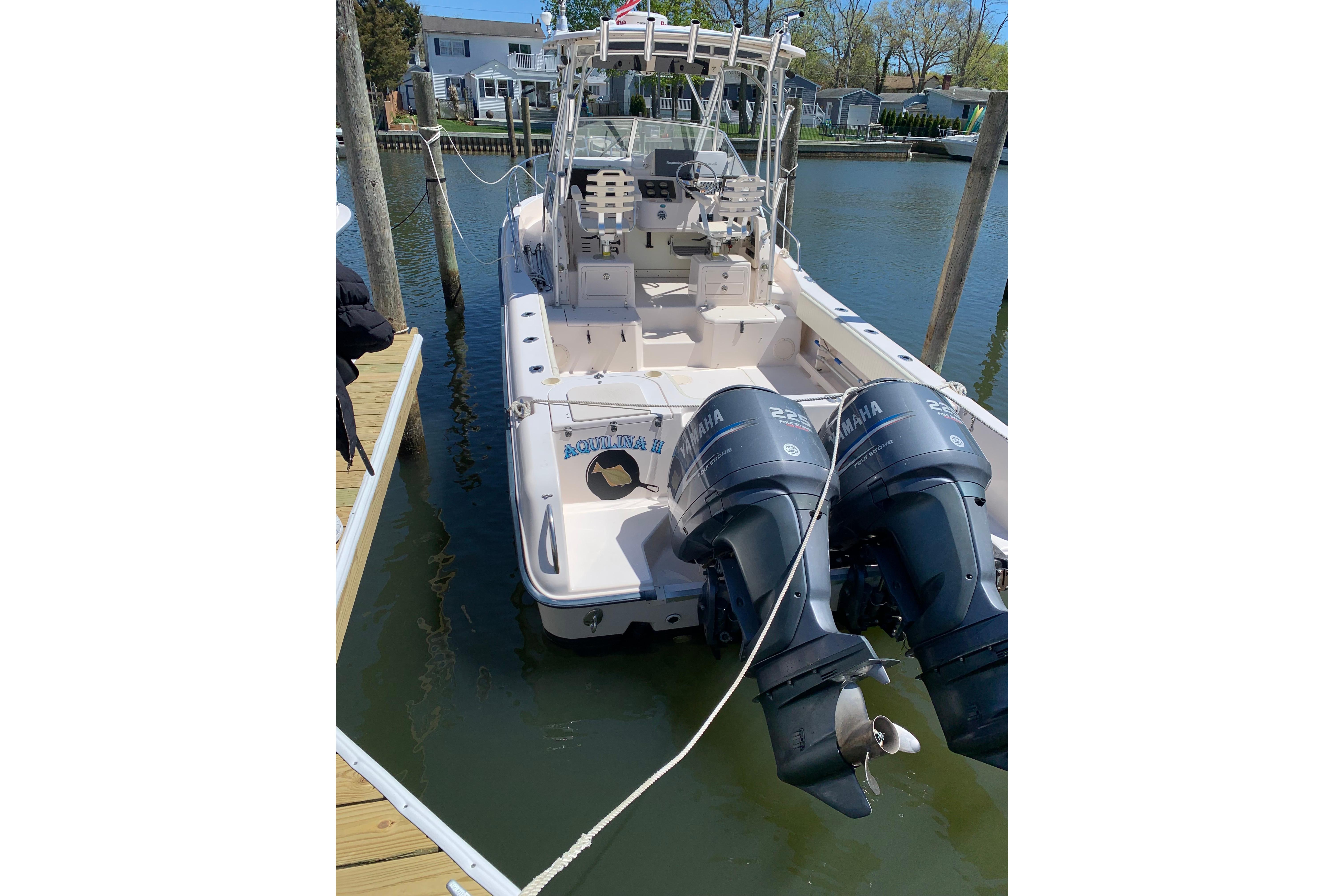 2004 Grady-White Sailfish 282 boat docked with twin Yamaha outboard engines.