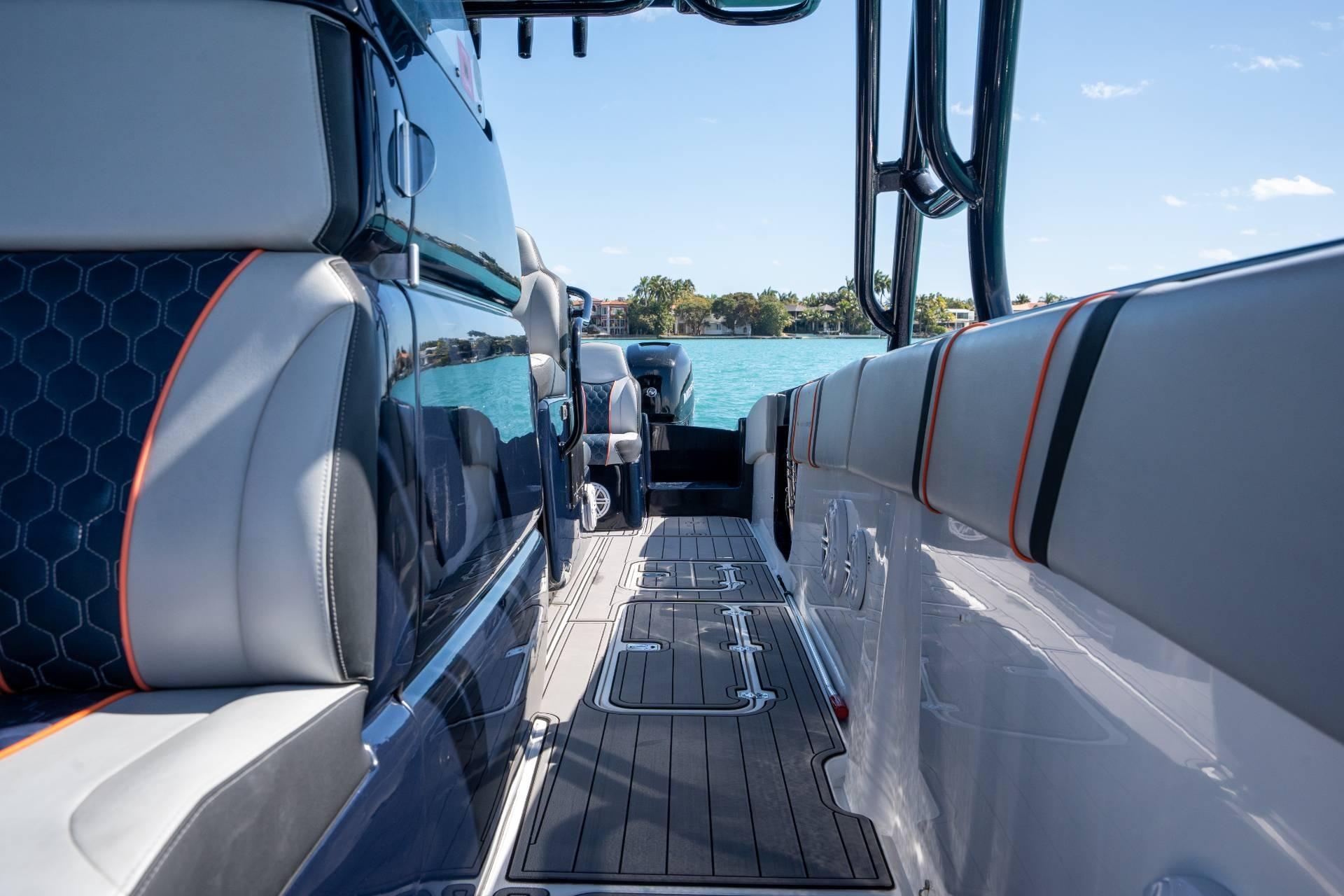 Interior view of 2014 Midnight Express 37 Open boat with sleek seating and ocean backdrop.
