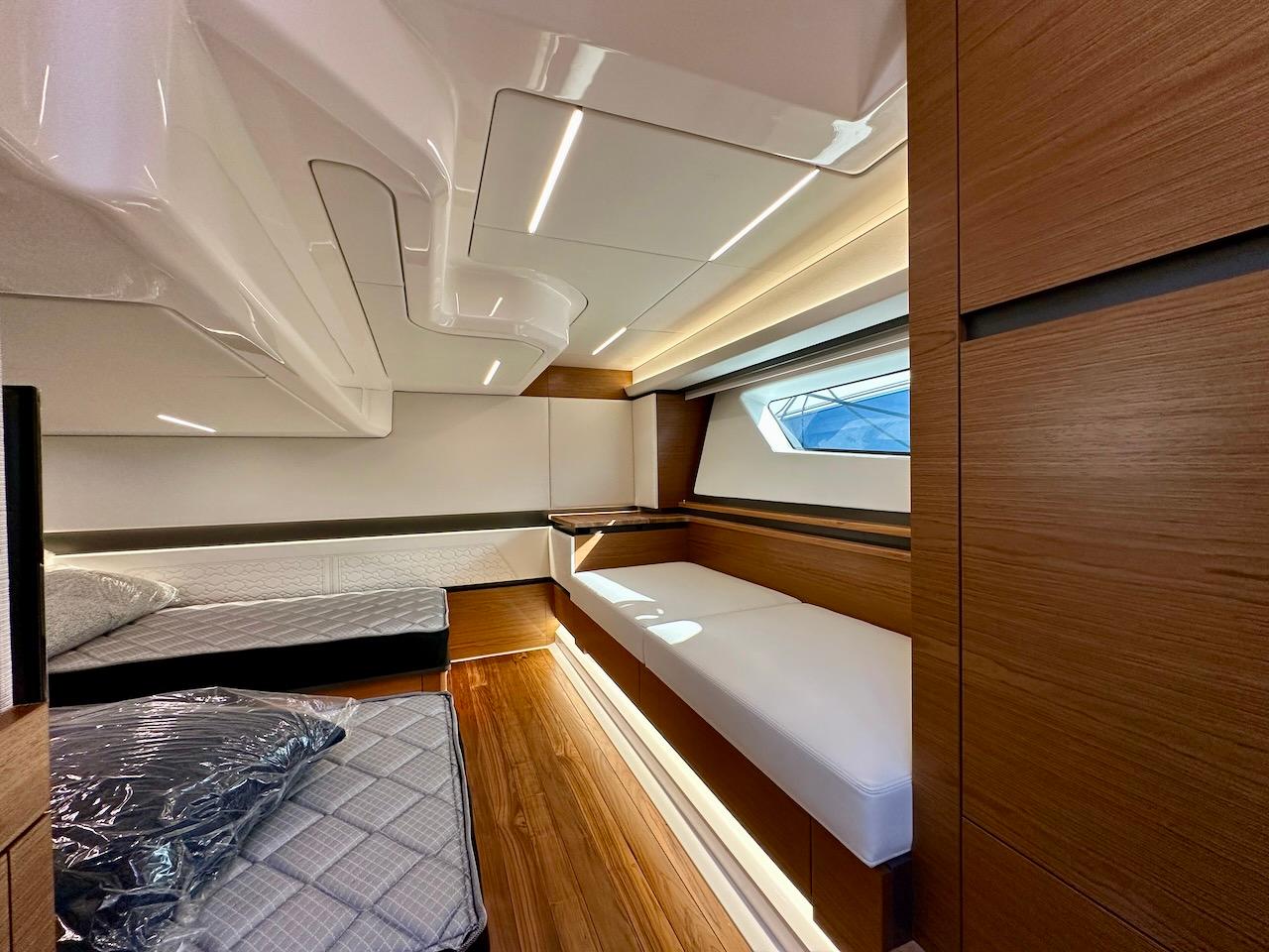 Interior of 2025 Tiara Yachts 48 LE, featuring modern wood finishes and sleek design.