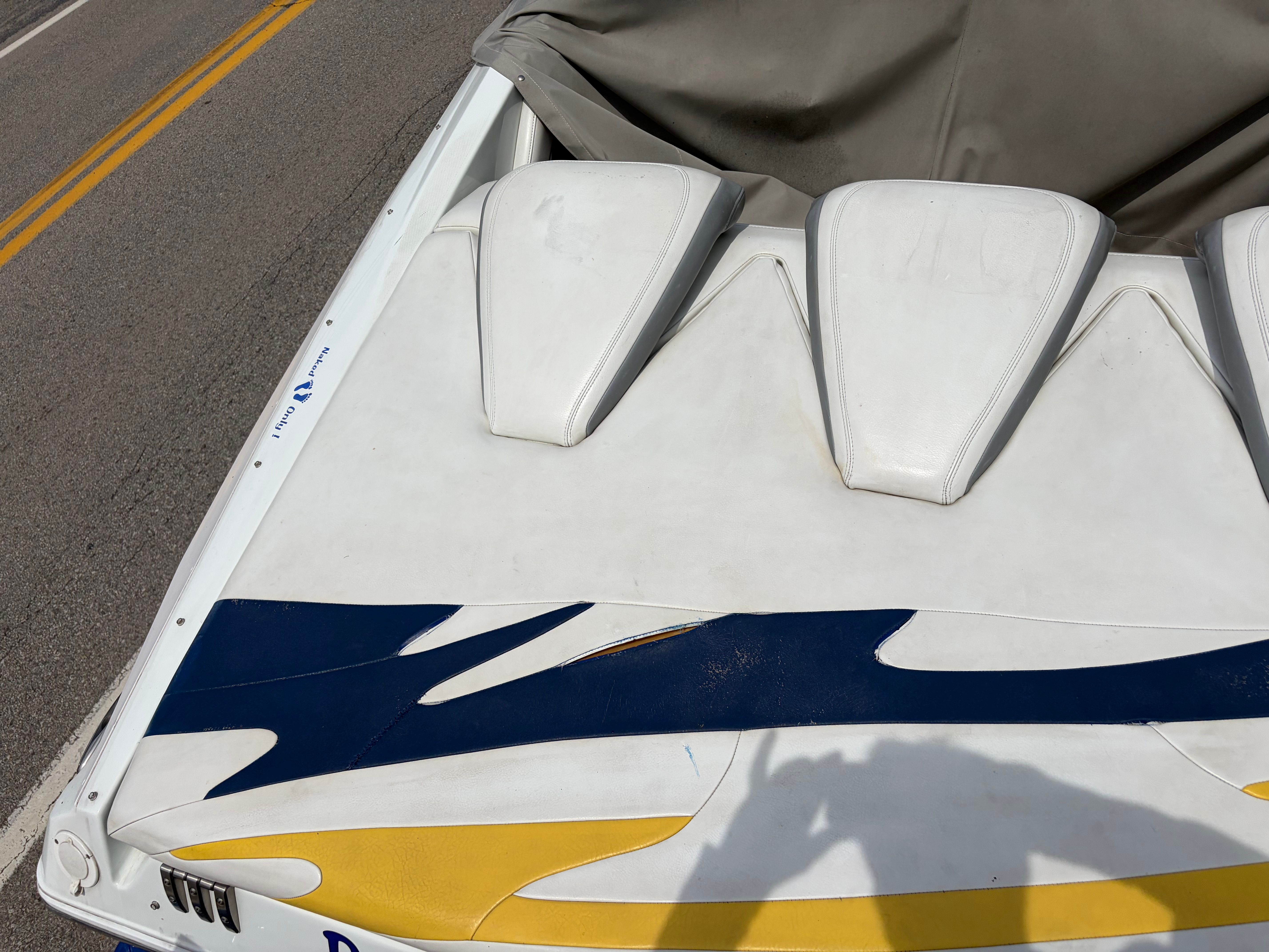 2007 Baja 30 Outlaw boat on road with cover.