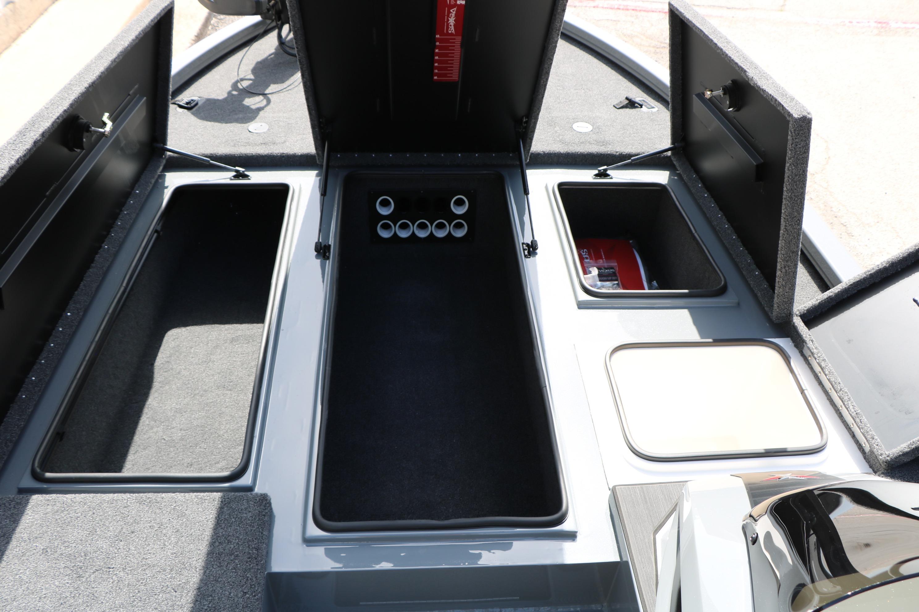 2026 Vexus AVX1980 boat storage compartments with open lids, showcasing interior space.