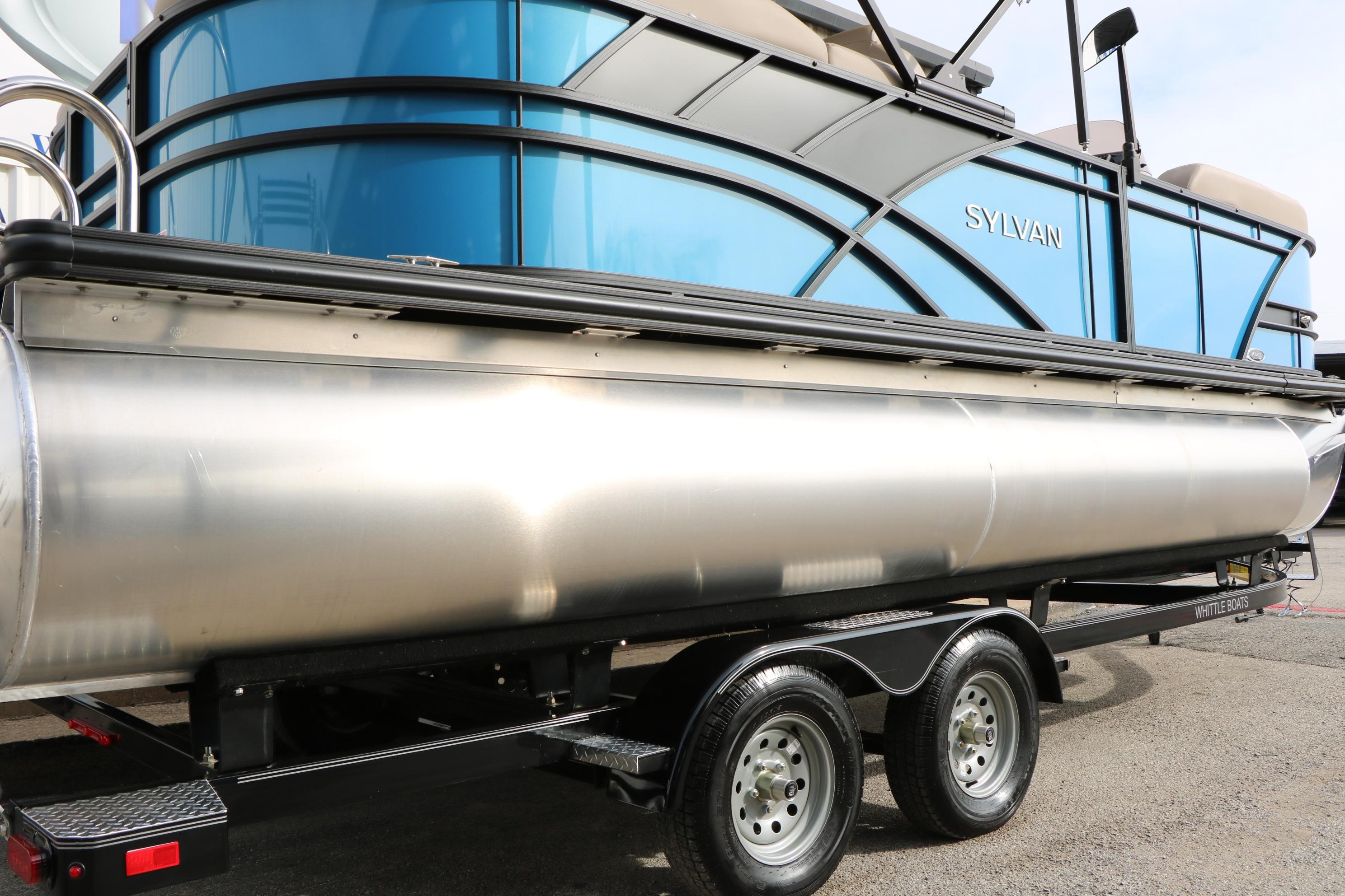 2026 Sylvan Mirage 822 LZ pontoon boat on trailer, blue and silver design.