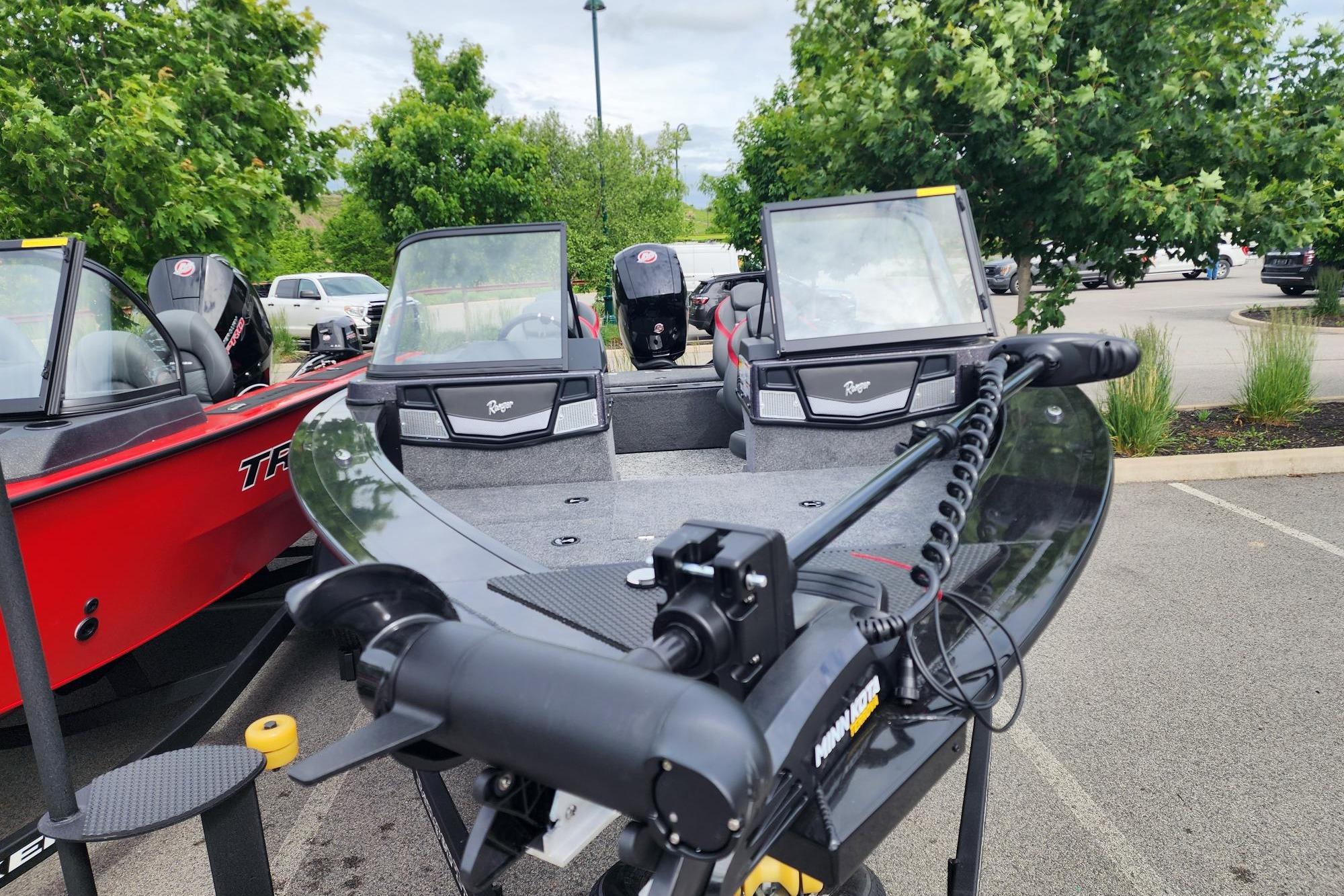 2026 Ranger VX1788 WT fishing boat with trolling motor in parking lot.