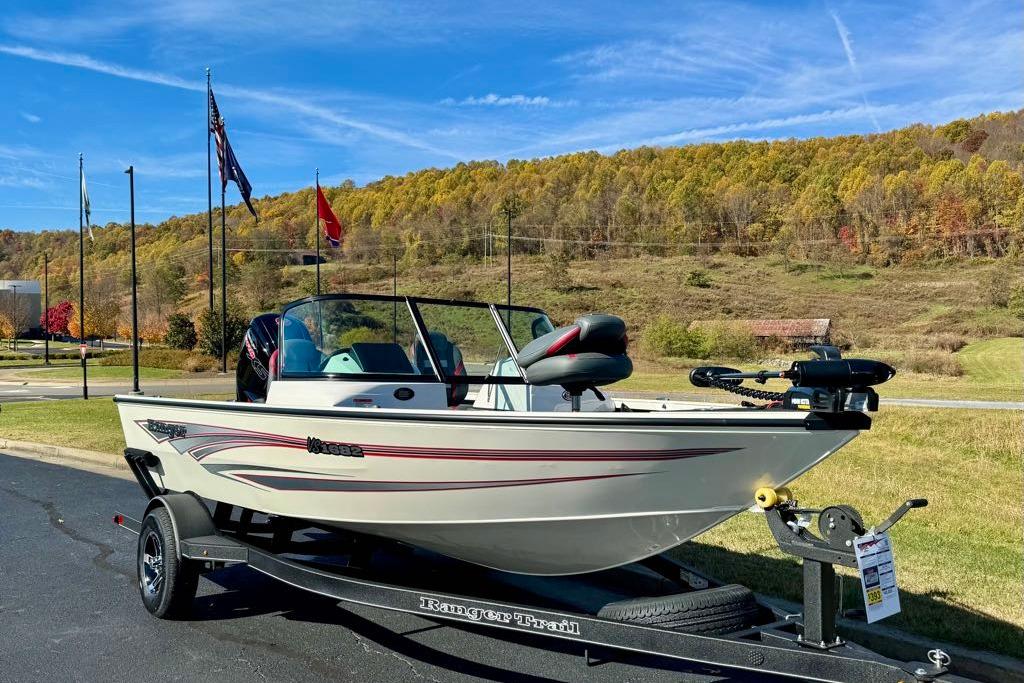 2026 Ranger VS1682SC Angler boat on trailer, scenic background with flags and autumn trees.