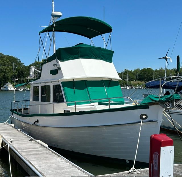 1980 Grand Banks 32 Sedan docked on a sunny day.