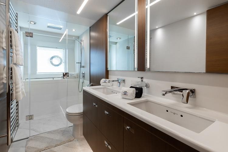Luxurious yacht bathroom with dual sinks, glass shower, and modern fixtures, Princess 2017 model.