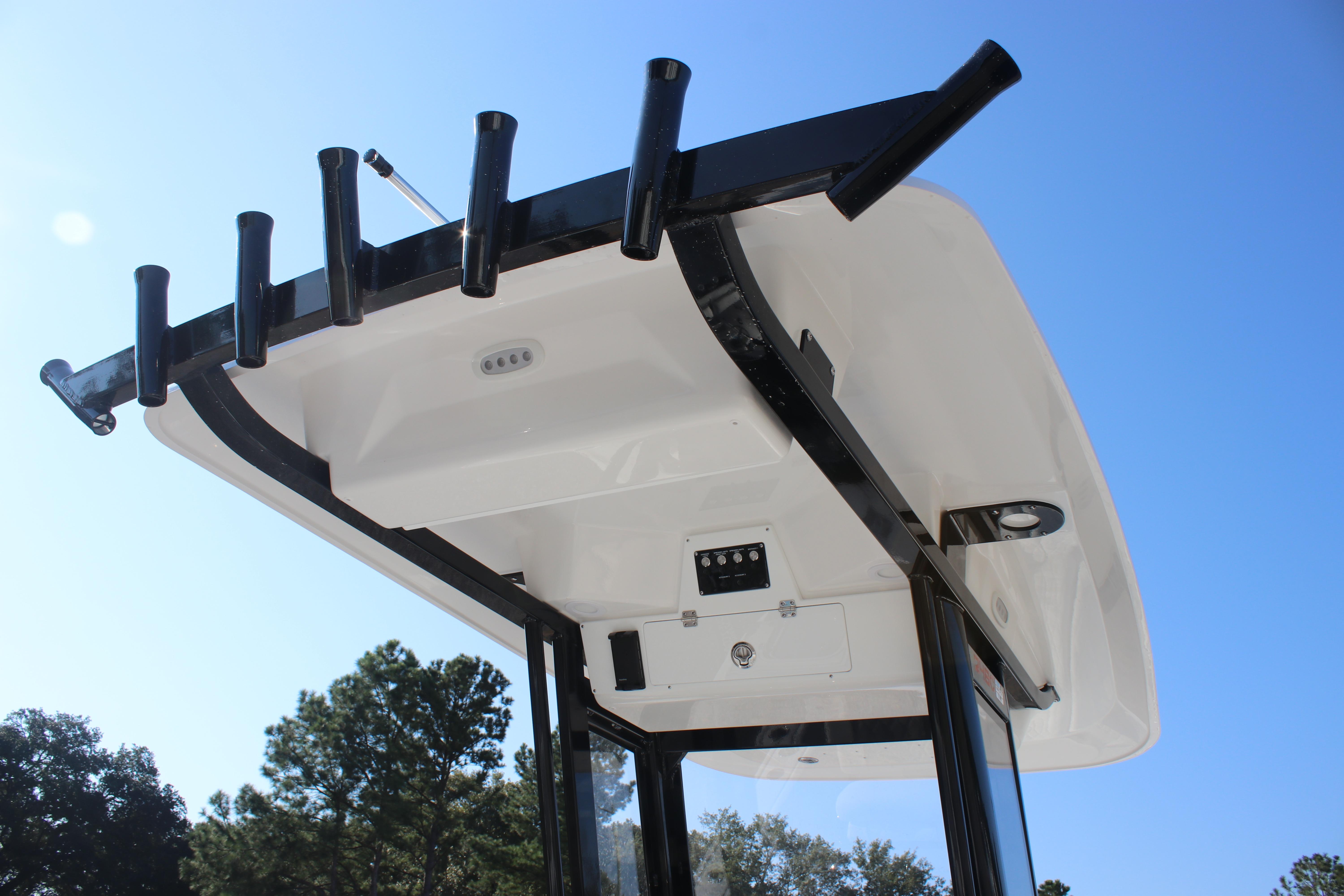 2026 Sea Fox 248 Commander boat top view with rod holders against blue sky.