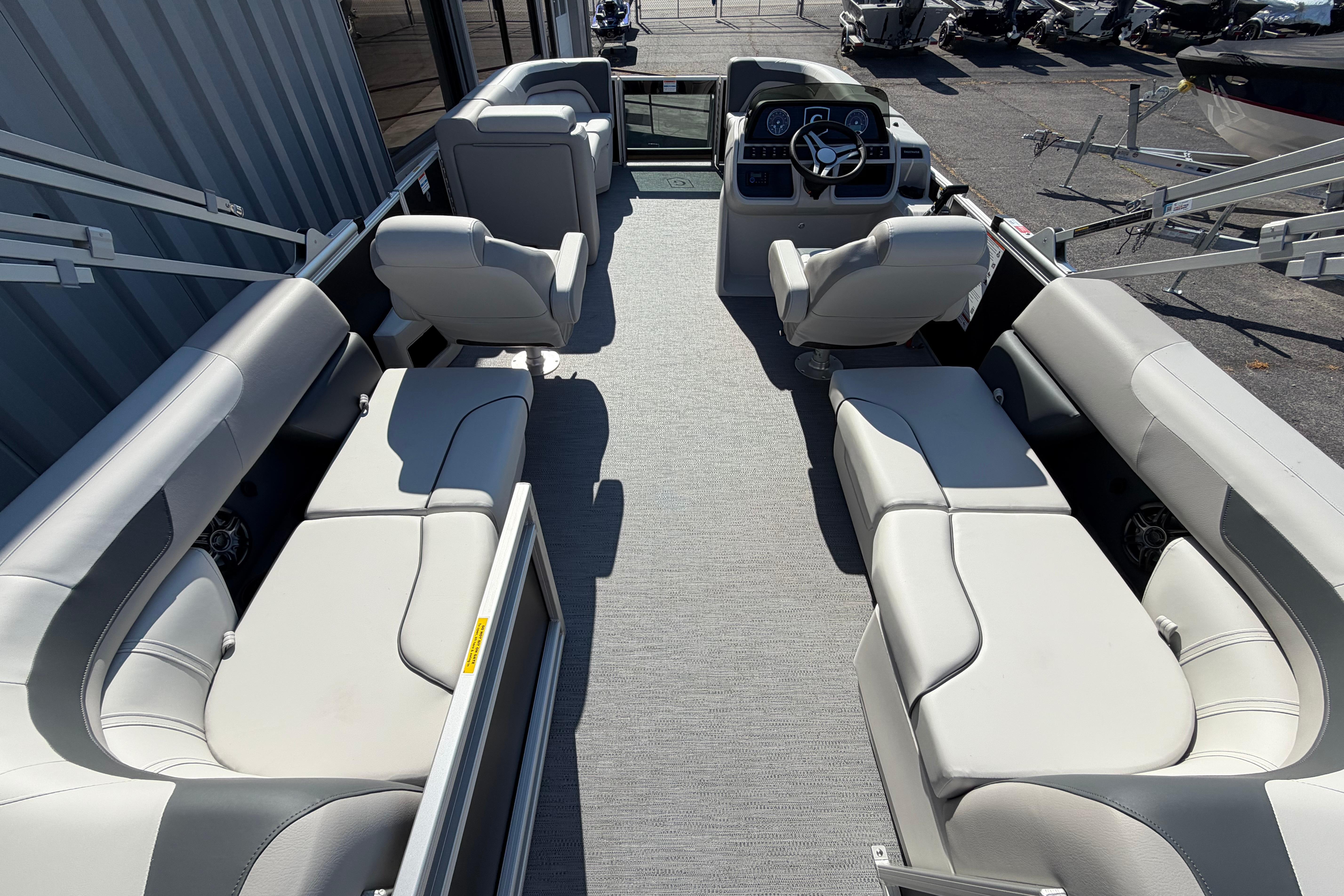 2026 Godfrey Sweetwater 2086 SBC pontoon boat interior with plush seating and modern helm.