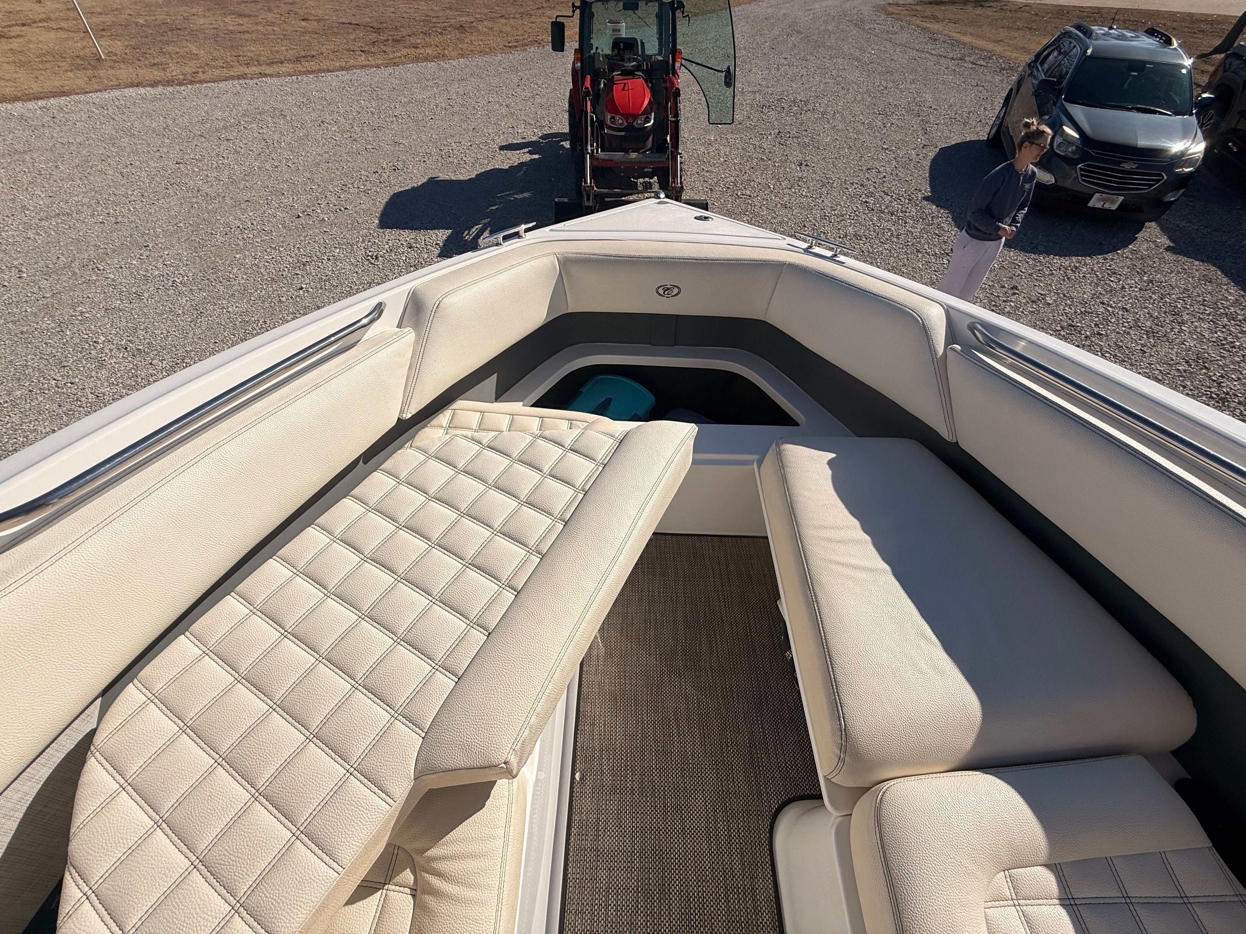 The image shows the cockpit of a 2019 Cobalt R7 Surf boat with beige upholstery.