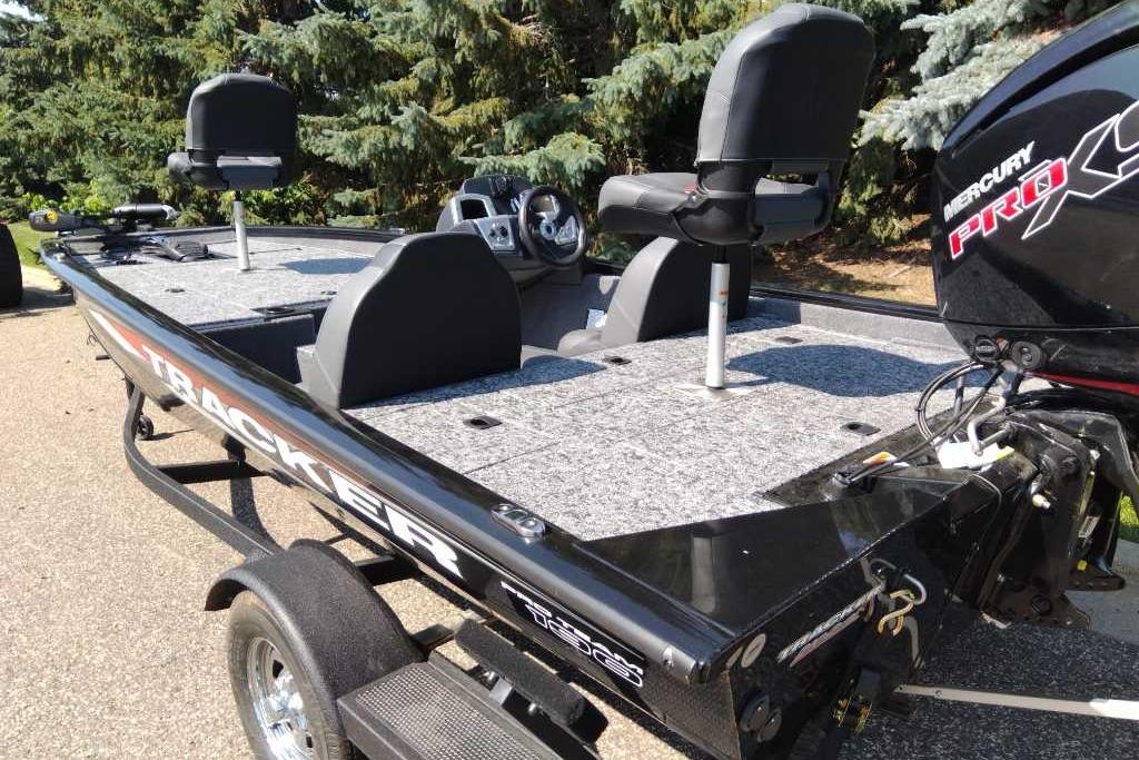 2026 Tracker Pro Team 190 fishing boat with Mercury Pro XS engine, parked outdoors.