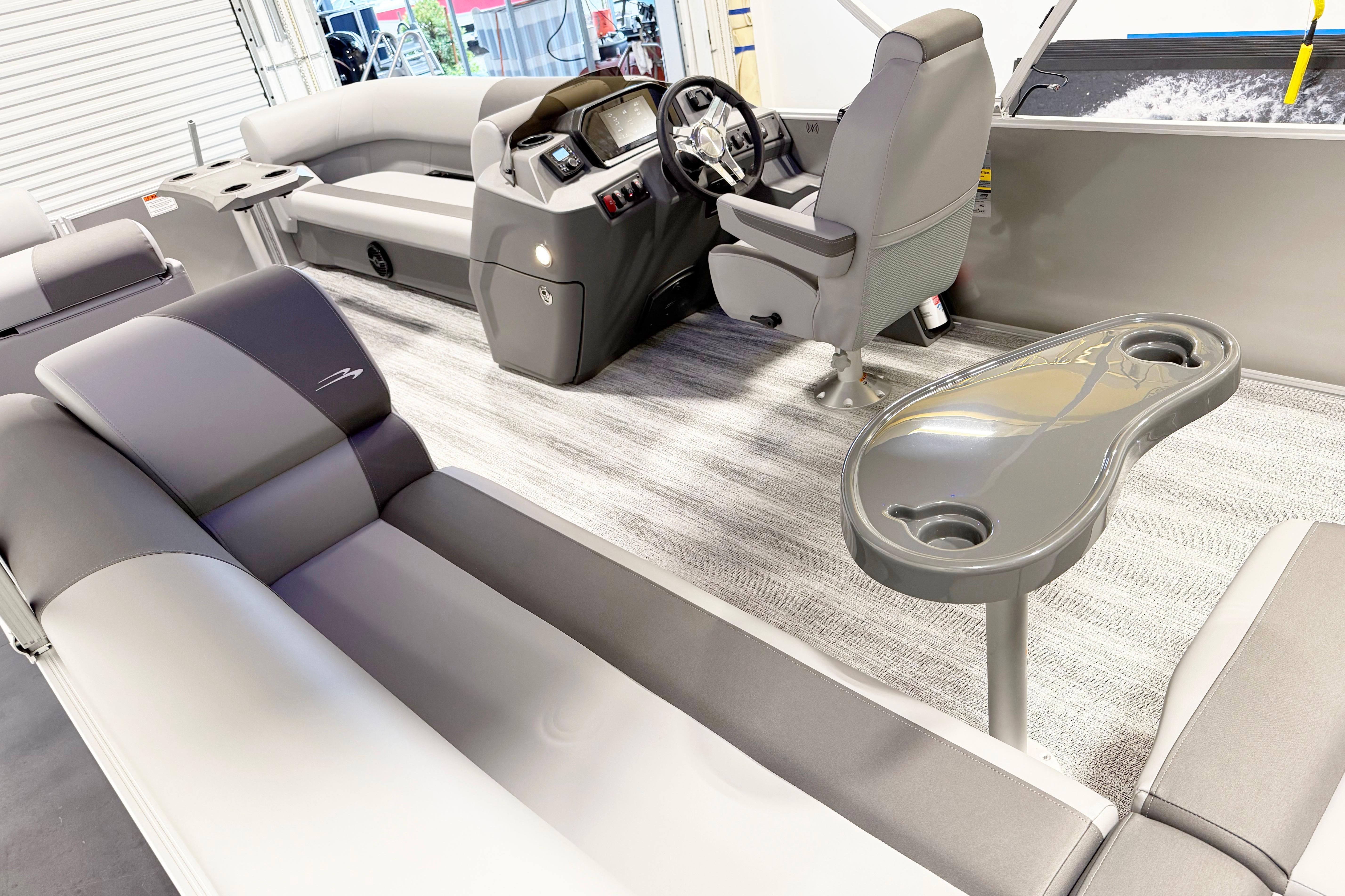 Interior of 2025 Bennington 21S Cruise pontoon boat with modern seating and helm.