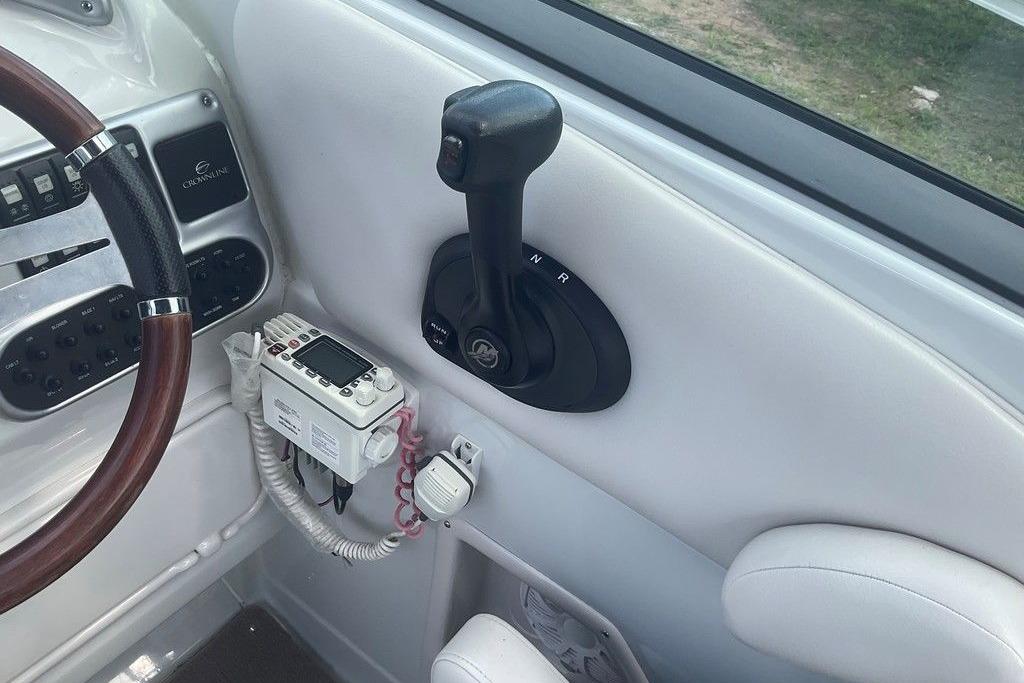2015 Crownline 236 SC boat cockpit with steering wheel and control panel.