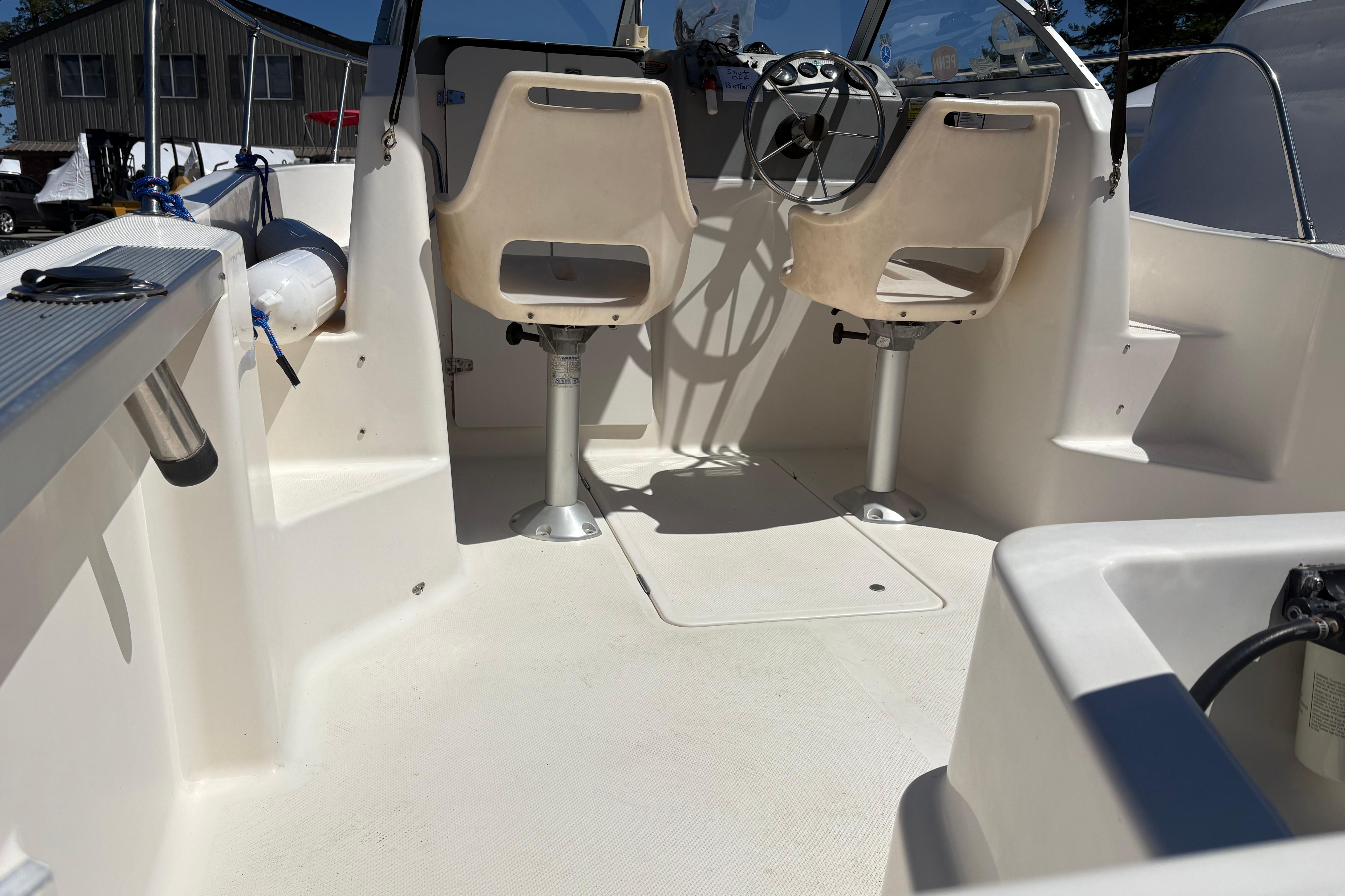 2004 Trophy 1802 Walkaround boat interior with dual seats and steering wheel.