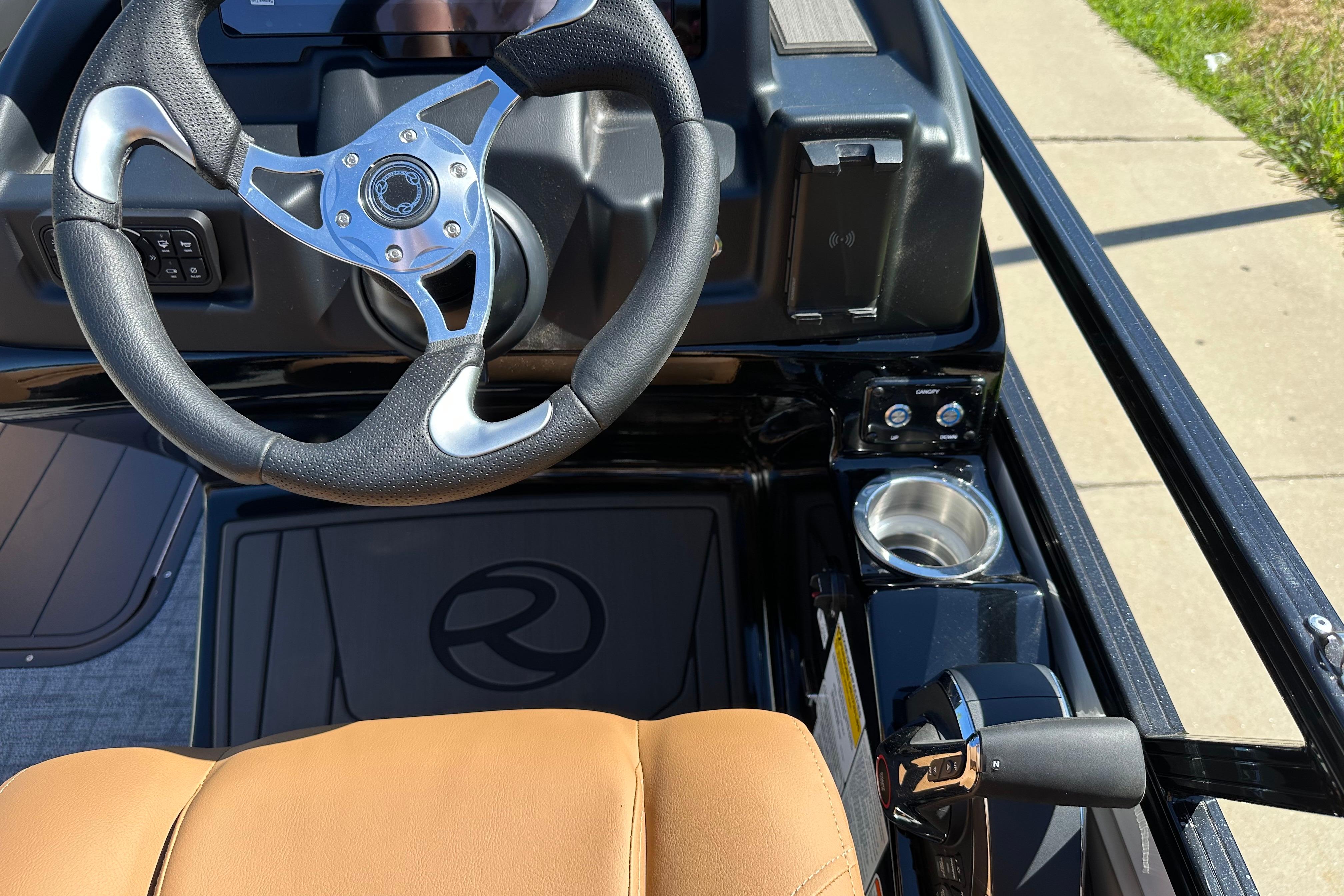 2026 Regency 230 DL boat dashboard with steering wheel and controls.