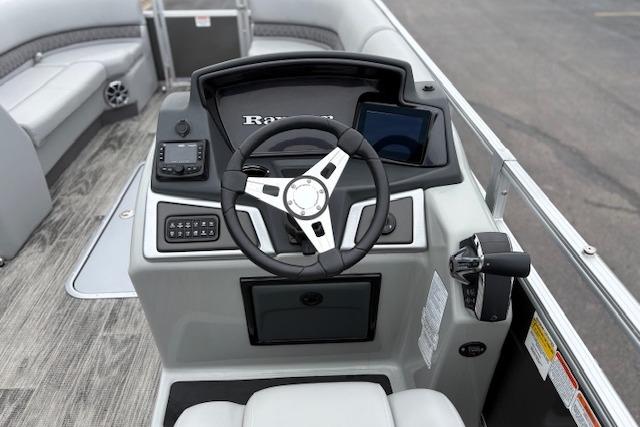 2025 Ranger Reata 243C boat console with steering wheel and navigation controls.