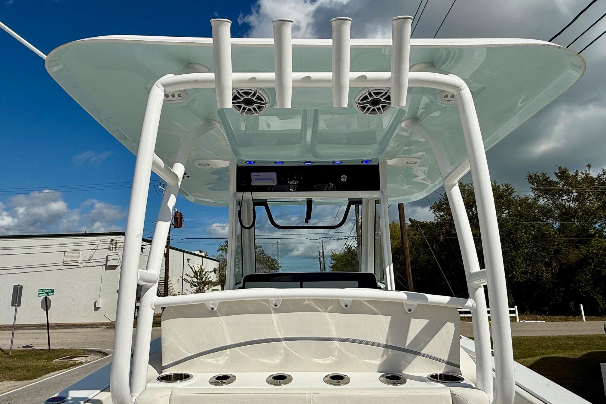 2026 Sea Hunt Ultra 285 Coffin Box boat with T-top and rod holders.
