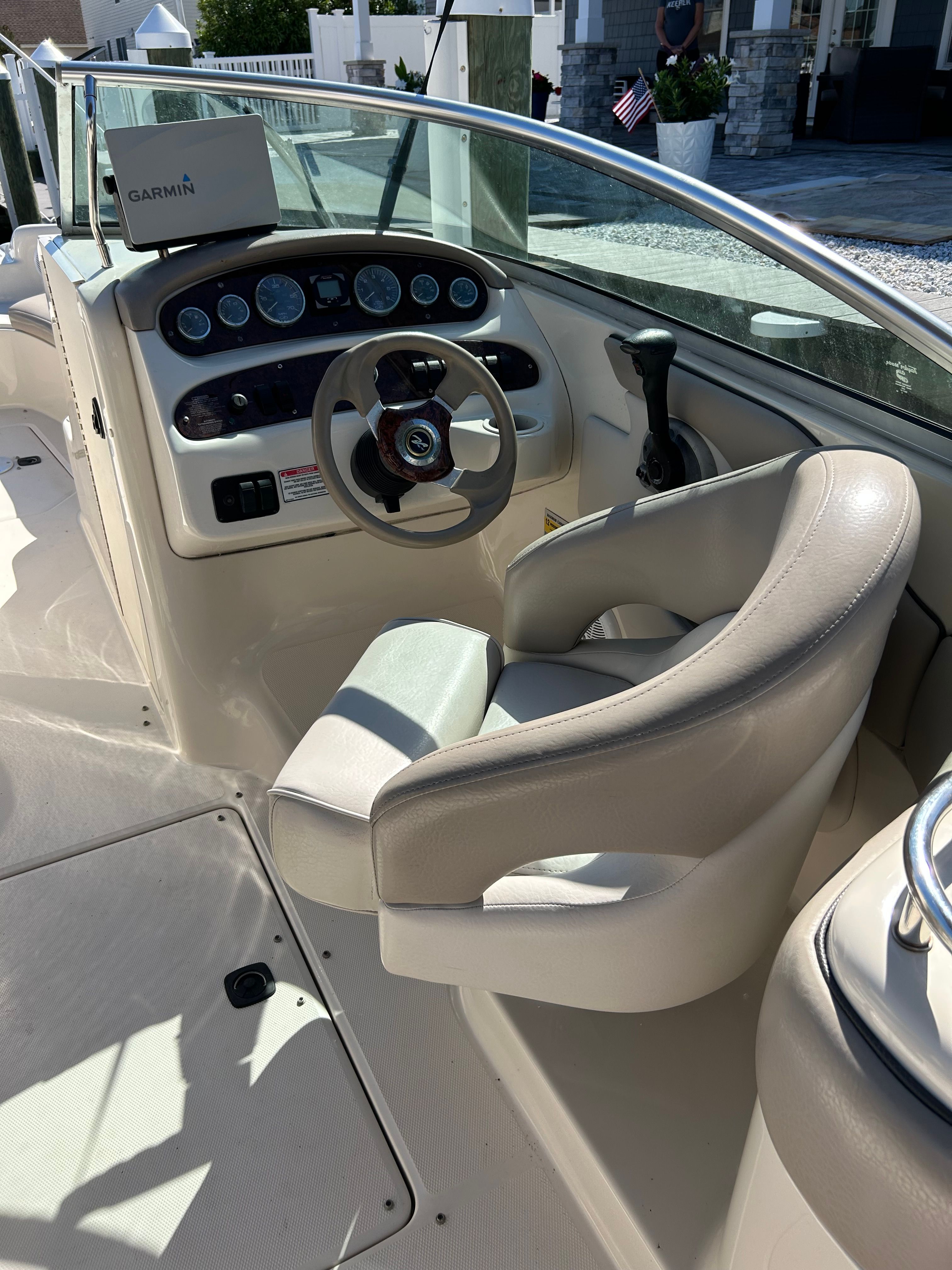 Interior of a 2003 Sea Ray 240 Sundeck boat with helm console.