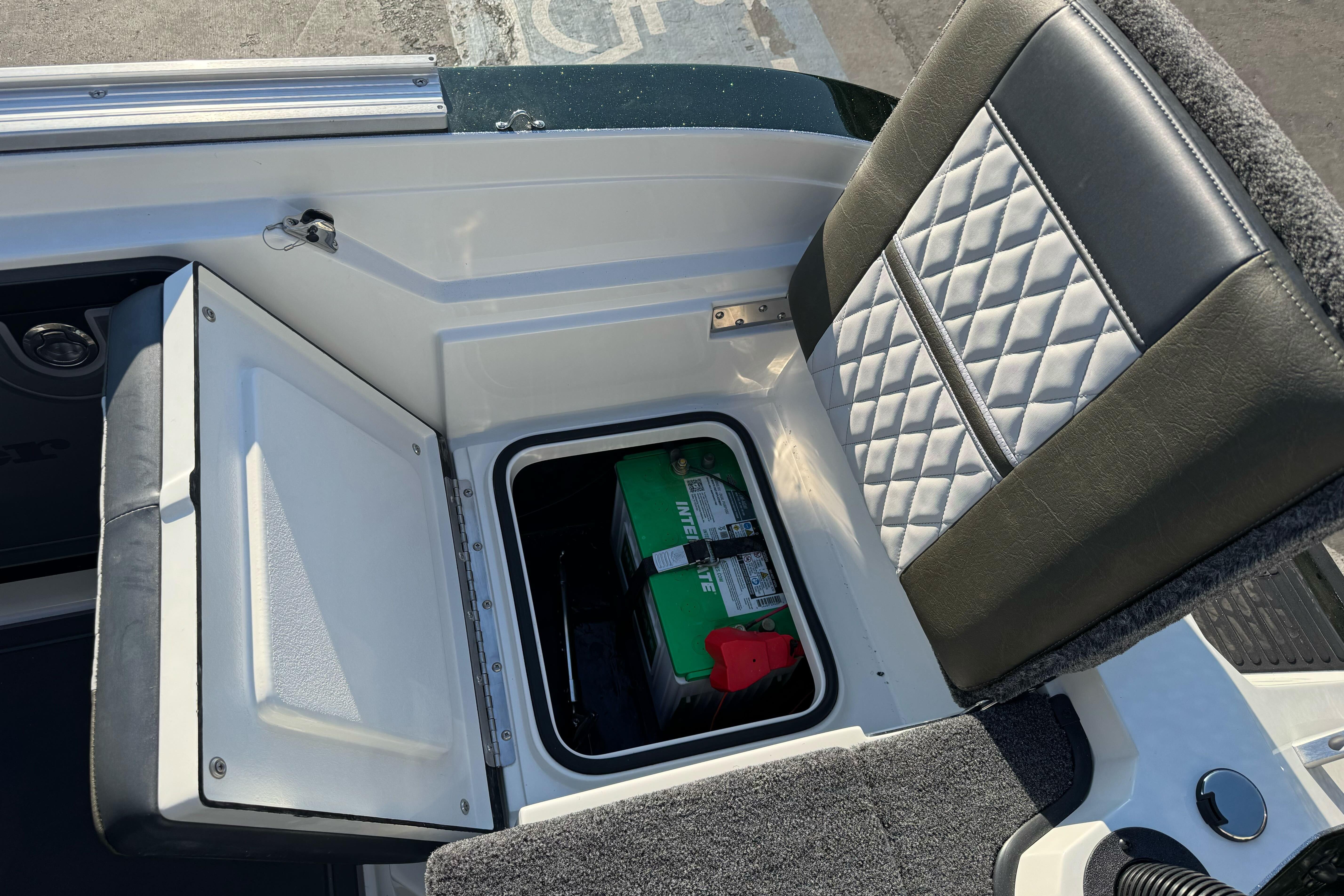 2026 Ranger 620xFS Pro boat seat with storage compartment and battery.