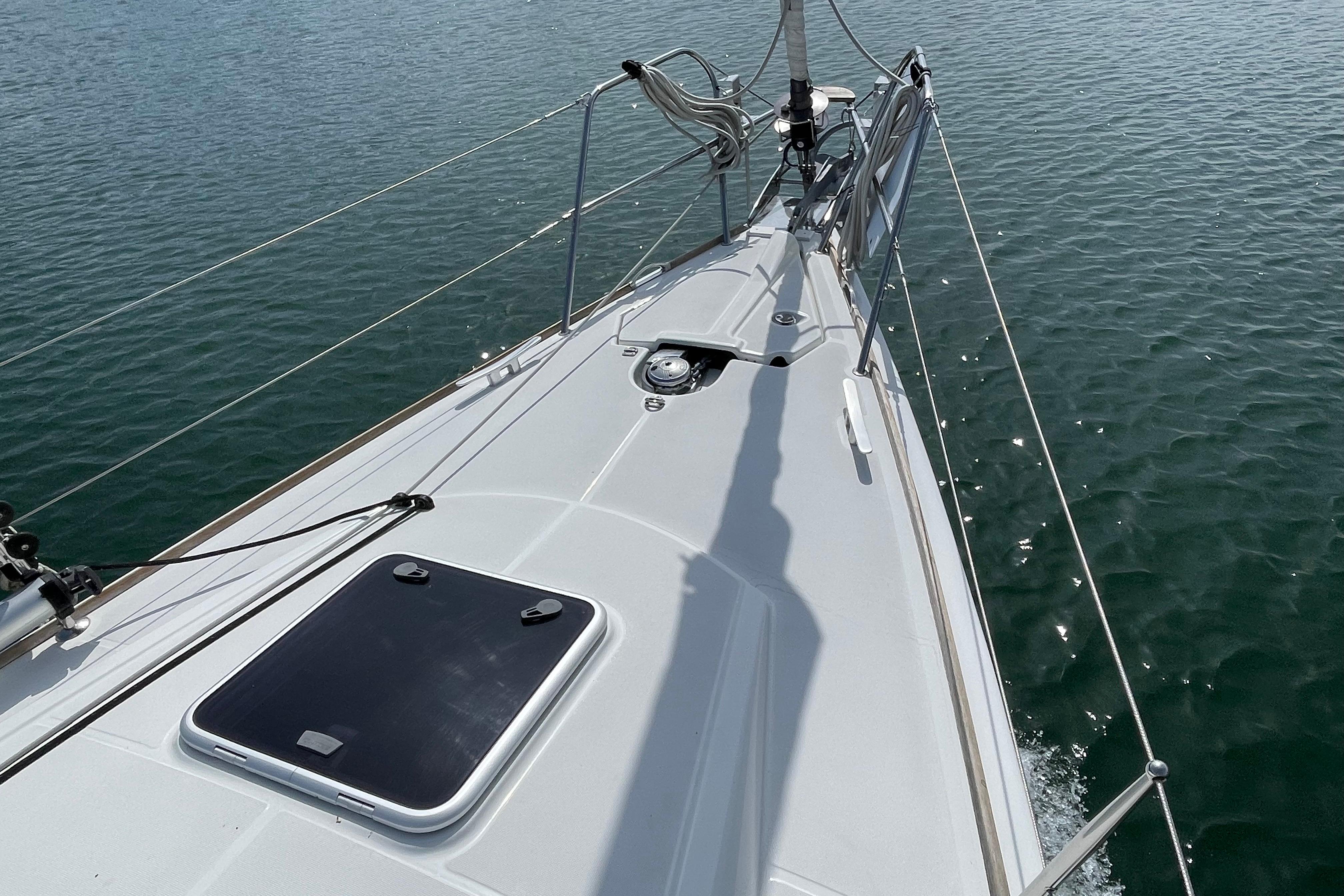 2007 Jeanneau Sun Odyssey 39 DS sailboat deck on calm water.