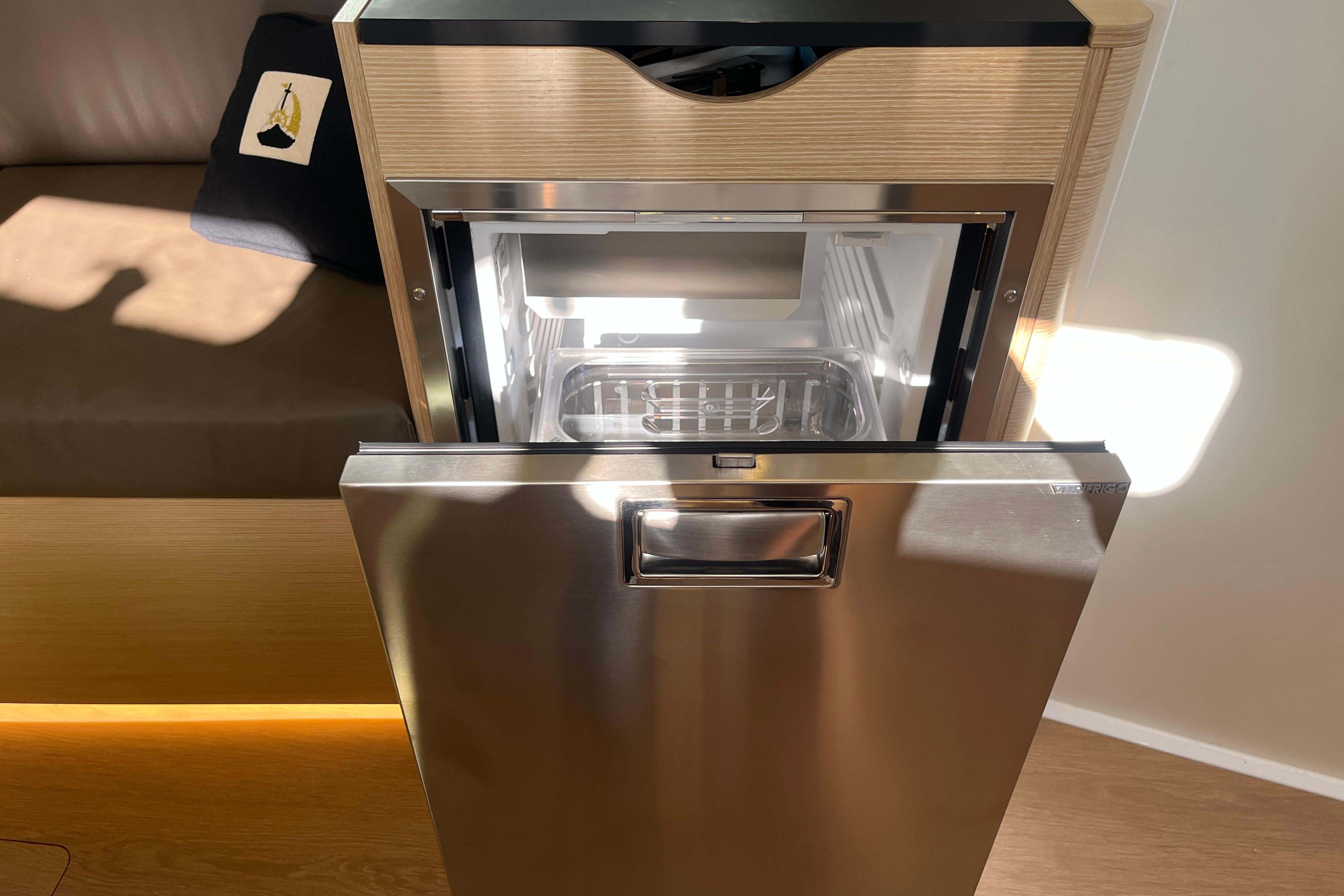 Modern stainless steel refrigerator in a Hanse 360 yacht, 2025 model.