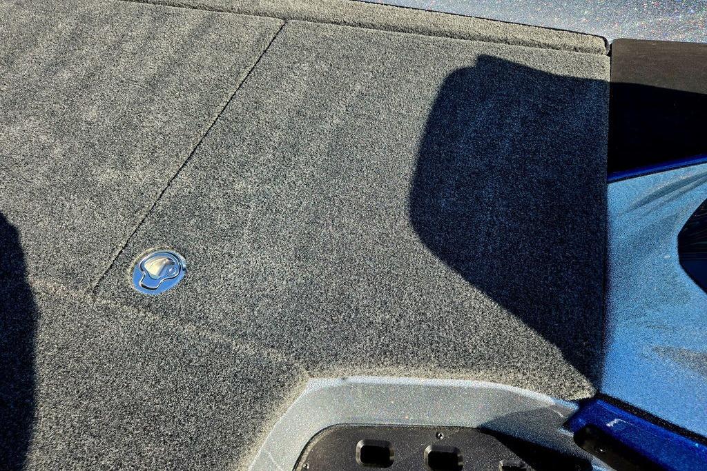 Carpeted deck of 2026 Skeeter ZXE20 boat with metal latch.