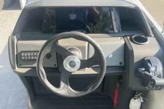Steering console of 2026 Sun Tracker Party Barge 18 DLX pontoon boat.