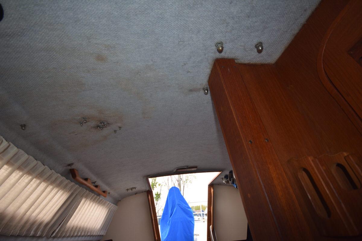 Interior of a 1987 S2 9.2A with wood furnishings and curtains.