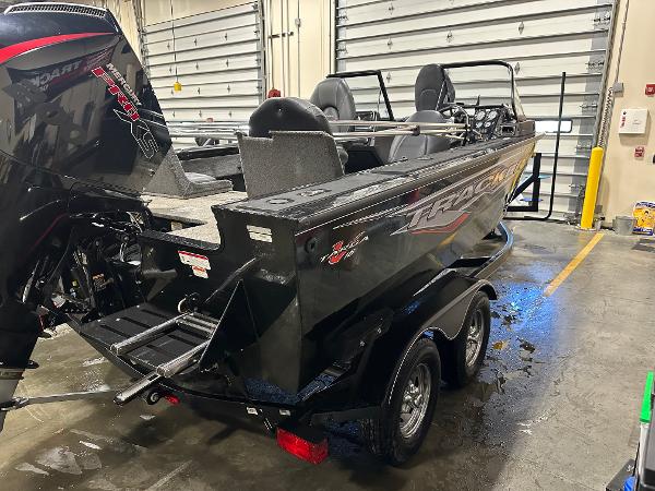 2023 Tracker Targa V-18 WT boat in a garage, rear view.