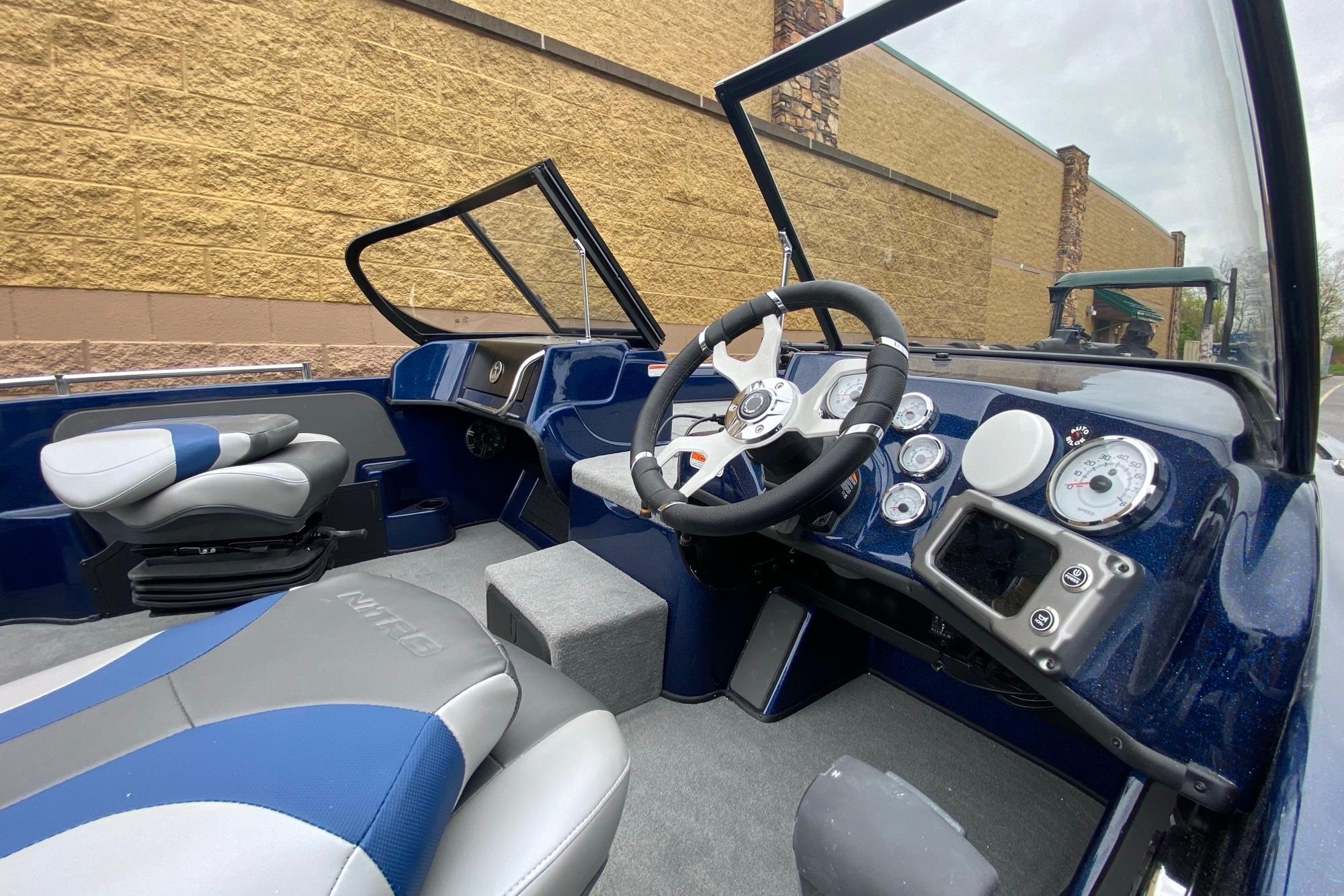 Interior of 2026 Nitro ZV19 Pro boat with modern dashboard and seating.
