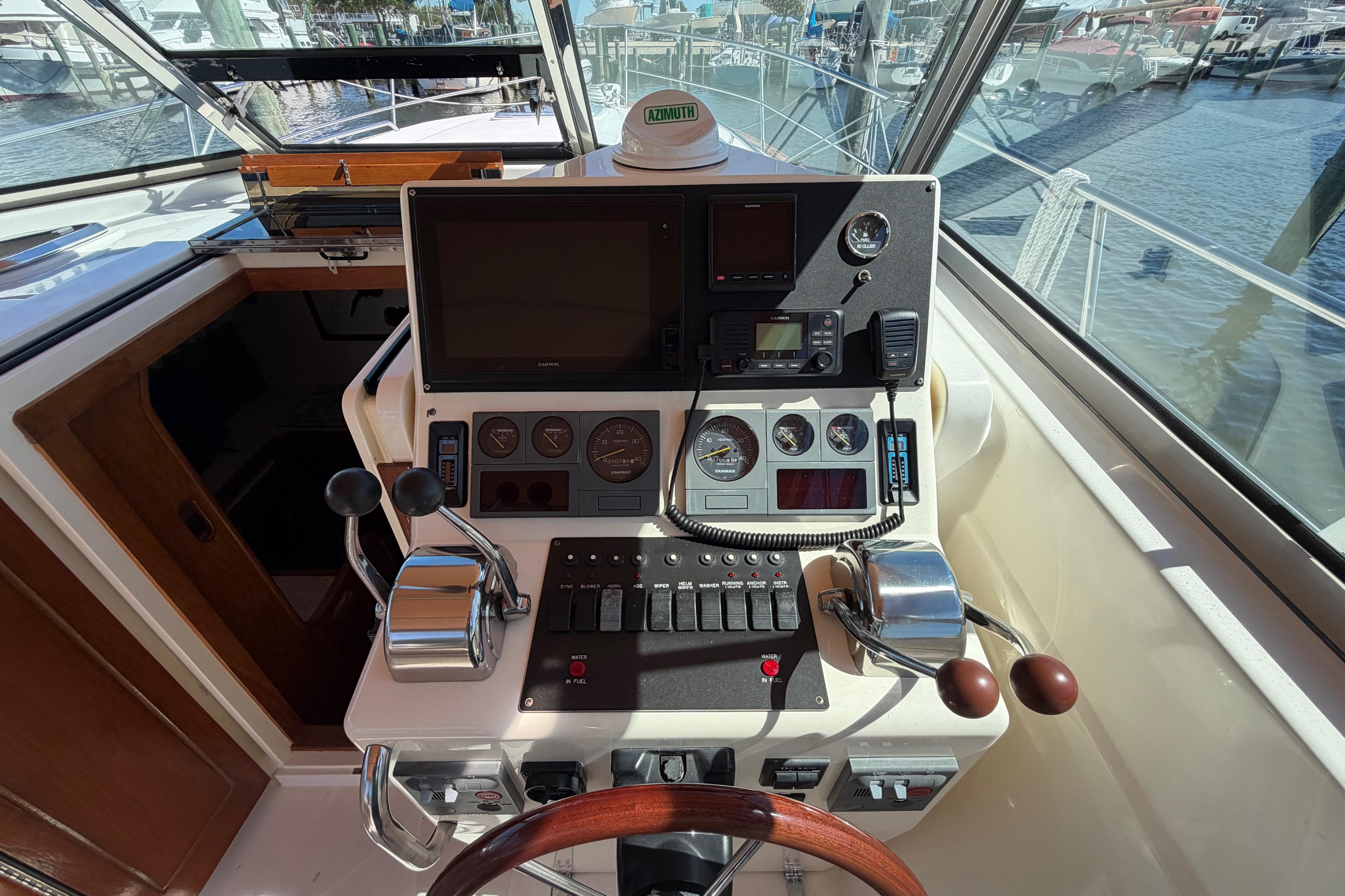Helm of 2000 Sabreline 36 Express boat with navigation controls and gauges.