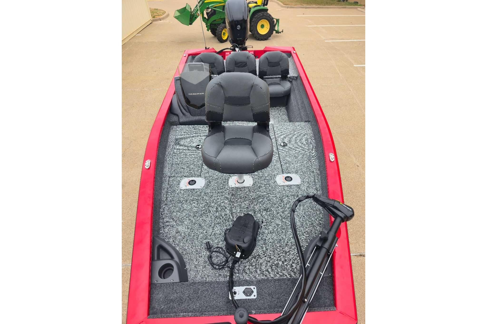 2026 Tracker Pro Team 175 Crappie Edition boat with red exterior and gray seating.
