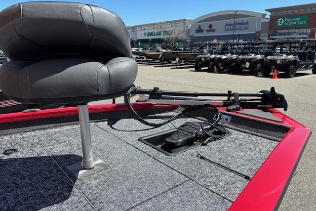 2026 Tracker Pro Team 175 boat deck with seat and trolling motor in parking lot.