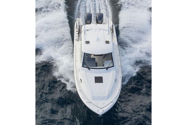 Manufacturer Provided Image: 2021 Pursuit OS 325 Offshore boat cruising on water.