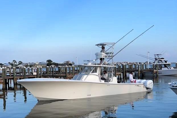 2020 Front Runner 39 Center Console boat docked in calm waters.