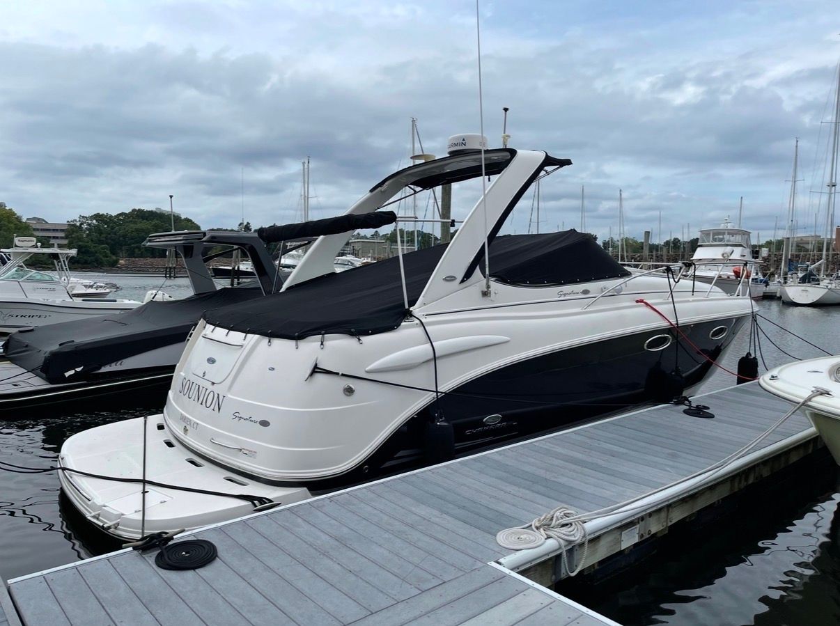 2006 Chaparral Signature 310 boat docked at marina.